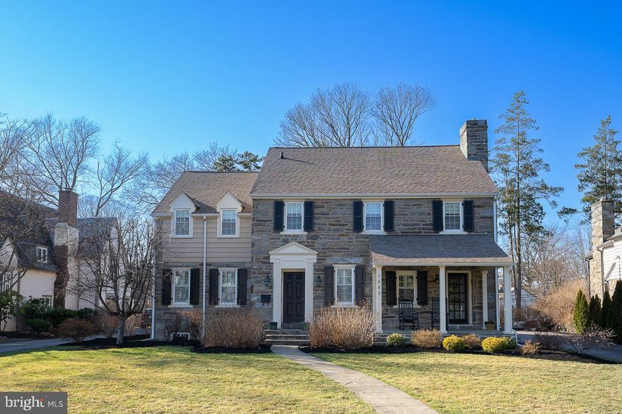 Welcome to 1405 Hillside Road, a sophisticated Main Line Center Hall Colonial home on a picture perfect, quiet Wynnewood street.  With easy access to shops and restaurants of both Wynnewood and Suburban Square in Ardmore, this home offers convenience and tranquility.  Upon entering you will immediately notice the beautiful crown molding and hardwood floors that flow throughout the home.  The stylish living room off the entry features fireplace and access to the classic front porch.  The sunlit dining room with wainscoting and large bay window flows into the remodeled gourmet kitchen with pantry, quartz counter tops,  large island, upscale quality subway tile backsplash, and is complete with top of the line refrigerator, double oven, food warmer and two small beverage refrigerators. Off the sizable kitchen is the spacious family room with built-ins perfect for desk/office area,  plus TV cabinet. Powder room off the kitchen and family room and the custom added mudroom complete with cubbies (for 4), storage area and two exit doors for access to both the driveway/brand new 2-car garage area and the large patio with custom fire pit. Flat backyard, with plenty of space for events, parties and evening dinners al fresco.  Second floor has four bedrooms;  a main bedroom with double sink ensuite bathroom, large walk-in closet with custom cabinetry, a second bedroom with ensuite bathroom, a hall bath and two additional bedrooms and laundry.  The third floor has a fifth bedroom and another full bathroom.  Finished basement has plenty of room for gym equipment and playroom and offers an additional full bath. Custom window treatments and plantation shutters and recessed lighting are through-out this amazing property.  Located in the Award Winning Lower Merion School District, this home is a must see!