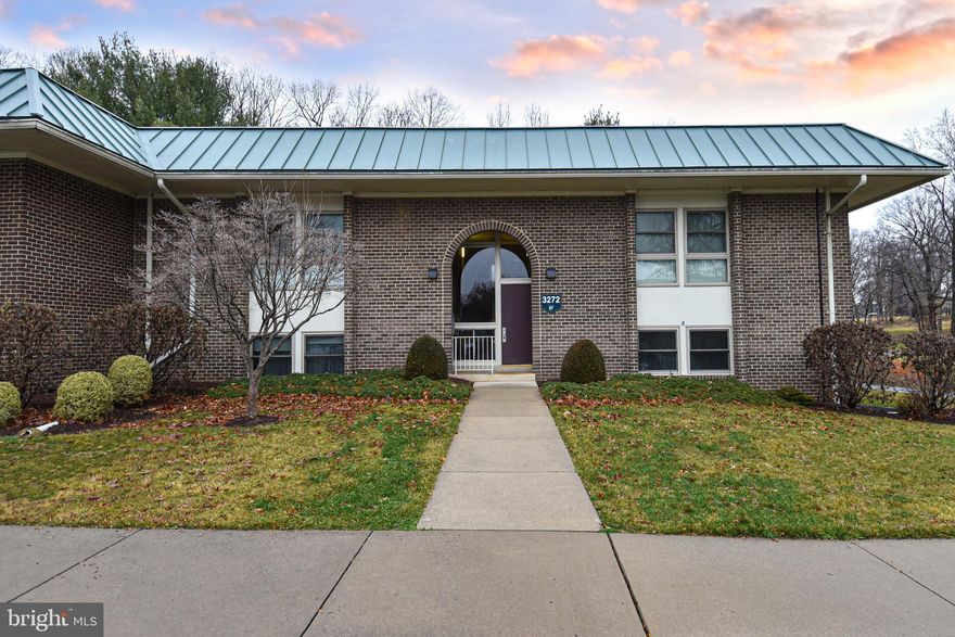 55 and over gated community.  Lovely Hampton  Model with enclosed patio.  2 Bedrooms, 1 Full Bath.  Luxury Vinyl tile plank, updated bathroom, fresh paint.  Stainless steel appliances.   Full sized washer and dryer in the unit.  No steps up to building.  1 assigned parking space and plenty of Visitor spots.  The view is of the Golf Course.   Sold "as is".