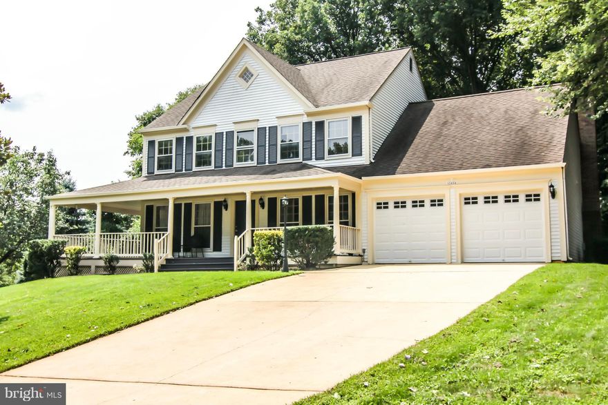 Amazing remodeled SF in well sought after Montclair. Great corner lot w/ a country porch. Kitchen w/granite counters, new cabinets, ceramic tile floors, SS appliances. Hardwood floors, office w/built-ins, DR w/beautiful bay window. FR w/brick wood burning fireplace. FR room w/walk out to deck. UL w/brand new carpet, BR & renovated BT w/ceramic tile & granite. Lower offers a 5th BR & full Bath.