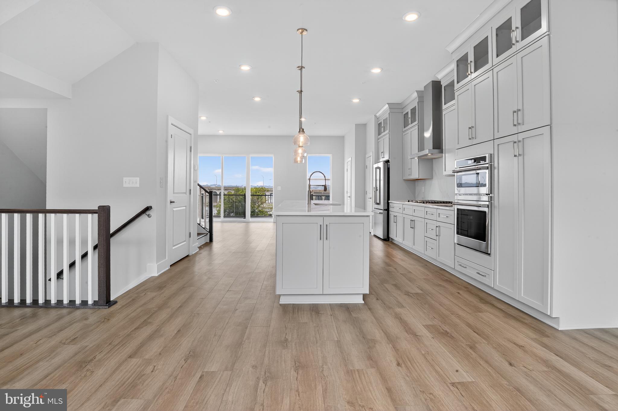 **Up to 40K IN FLEX CASH WITH USE OF APPROVED LENDER AND TITLE! Lower your price, cover your closing costs, or buy your rate down**Partial incentive applied towards price of home.**
Welcome to the Waterford, an elegant four-level townhome boasting an open-concept floor plan ideal for relaxing and entertaining with spectacular views of Historic Hanover Bridge and Patapsco River. The main level features a well-appointed kitchen flanked by a large family room and casual dining area. With a stately island offering ample seating serving as the focal point, the main level overlooks large sliding glass doors leading to a deck placed off of the rear of the home. Upstairs, a sophisticated primary suite awaits, complete with a spacious walk-in closet and full bath, highlighted by a large seated shower and a dual sink vanity. Secondary bedrooms and a shared bath are situated just down the hall, along with bedroom-level laundry and a linen closet. This Waterford also features a rooftop deck, accessible from the townhome's fourth-level loft and secondary primary suite. The possibilities are endless! On the entry-level, enjoy the convenience of a 2-car garage with elevator access. The elevator services all levels of the home, a practical feature that adds to the luxurious nature of the home! ***THIS PROPERTY MAY QUALIFY FOR THE BROWNFIELD TAX CREDIT. WHICH COULD RESULT IN UP TO A 70% REDUCTION IN ANNUAL CITY PROPERTY TAXES FOR TEN YEARS***