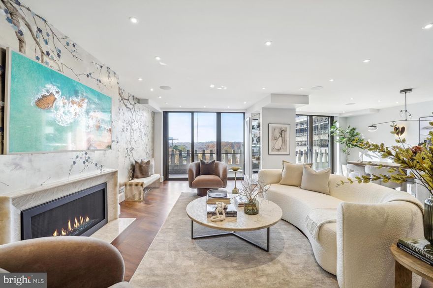 Enjoy a scenic river vista and captivating sunsets in this recently renovated 2,459 sq ft
residence. The interior boasts a stunning design, featuring spacious living and
dining areas adorned with high-quality walnut flooring. Throughout the space,
find extra-tall 7-ft high walnut veneered doors and top-of-the-line windows,
providing an elegant ambiance. The interior is adorned with a sophisticated serving bar, complete with a sink, Scotsman Icemaker, exquisite stone, silk upholstery wall panels, and 3/4" thick glass display
shelves. A Lumix Quartzite fireplace surround adds to the charm. The kitchen,
seamlessly integrated into the entertainment area, can be closed off with
statement double doors. It features a chef's kitchen with a waterfall counter
center island, stylish cabinetry, and a pull-out appliance garage. Equipped
with the finest appliances, including a Wolf range, Wolf microwave, Miele
dishwasher, Sub-Zero refrigerator, and Sub-Zero tall wine refrigerator.
The primary bedroom offers a double-sized space with hand-loomed carpeting, a sitting area, Lutron sheer shades, and a spa-style bath. The dressing room closet includes custom built-in
features for added convenience. The guest bedroom/office, situated at the
opposite end for privacy, features a built-in office area and a bright full
bath. Additional highlights include recessed Lutron designer lighting,
custom-designed closets, and a large powder room.
Wake up to the soothing river view and take advantage of the property's exceptional features, including
new floor-to-ceiling windows, a wide uncovered balcony,  two garage parking
spaces and two storage units. The co-op fee covers property taxes, utilities, internet/cable, HVAC
maintenance, and underground garage parking. Watergate South amenities include
a 24-hour front desk, salt-water outdoor pool, gas grill, fitness center, roof
terrace, community room, and on-site shops and restaurants. Conveniently
located with a high walk score, you can easily reach the Kennedy Center,
Georgetown Waterfront, Foggy Bottom Metro, Watergate Hotel & Spa, as well
as nearby restaurants, Whole Foods, and more.