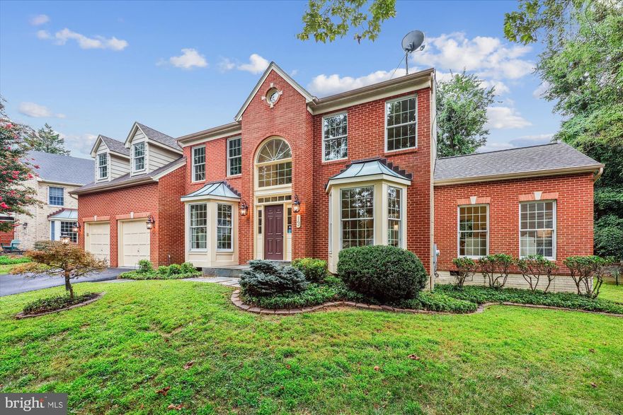 DEADLINE FOR OFFERS TENTATIVELY SET FOR WEDNESDAY, 8/27/25 @  3PM.  Unbelievable opportunity to own a detached home on a premium cul-de-sac lot in Rose Hill Falls. This stunning 4BR+den/3.5BA brick-front colonial with a two-car garage was built by the Magruder Companies and the quality of craftsmanship is everywhere.  Designer-home appeal includes a great sense of light and spaciousness with 9-foot, 10-foot, and cathedral ceilings, skylights, new custom painting, hardwood flooring throughout the main and upper levels, ceramic tile flooring in kitchen and baths, and elaborate moldings throughout; remodeled kitchen with granite countertops, stainless appliances, and 10-ft. center island opening to a step-down family room with floor-to-ceiling stone fireplace; glorious sunroom with sliding glass door to rear composite deck and private yard; BONUS conservatory rare to the neighborhood.  Flagstone front walkway and front stoop; grand two-story foyer entrance, curved staircase, coat closet and powder room; open formal living room with bay window and adjoining dining room with bay window; BONUS side conservatory off of living room with double glass door entry and ceiling fan; main level study with built-in bookshelf and bay window; gourmet kitchen with ceramic tile flooring, granite countertops, upgraded stainless appliances, 10-ft. granite center island/breakfast bar, recessed lighting, and pantry; sunroom/breakfast room off of kitchen with tile flooring, walls of windows, recessed lighting, two skylights, and sliding glass doors to composite deck; step-down family room with 10-foot ceiling, ceiling fan, and floor-to-ceiling stone wood-burring fireplace with raised slate hearth and wood mantel; mudroom off of kitchen with washer/dryer, utility sink, laundry chute, and access to two-car garage; curved solid oak staircase to upper level from foyer; enormous (26’ x 20’) primary bedroom suite with cathedral ceiling, private sitting room/office, and dormer storage closet; double glass doors to dressing room with walk-in closet, skylights, and vanity with makeup counter; primary bathroom with cathedral ceilings, double vanities, walk-in shower, jacuzzi whirlpool tub, and separate water closet; three additional bedrooms on the upper level and two additional full baths; unfinished lower level with walk-up stairs to Bilko door exit, painted concrete flooring, multiple areas for future expansion (recreation room, media room, exercise room, wine cellar, full bath rough-in); architectural shingle roof, dual-zone HVAC with new gas furnace and CAC on main level (2024), electric heat pump on upper level, and 75-gallon water heater (2021).  Without leaving the neighborhood, there are over a mile of bucolic walking/bike paths, forested conservation areas, sidewalks, two tot lots, a private tennis court, and a basketball court.  Adjacent to the development sits the City of Rockville's Bullard Park at one end of the neighborhood and Julius West Middle School's sports fields, track, and tennis courts on the other side.  Be part of the vibrant Rockville Town Center featuring shopping, fine restaurants, sidewalk cafes, the Rockville Regional Library, Regal Cinemas, and other entertainment/cultural facilities.  Less than a mile from the Rockville Metro for easy commute via mass transit.