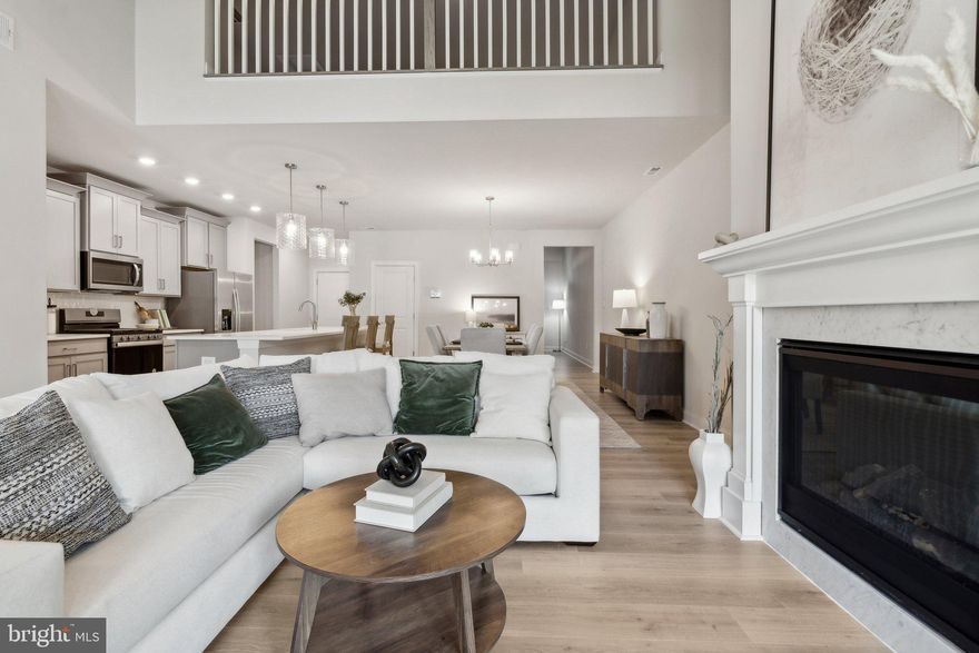 September move-in. Welcome home to the Lafayette, our two-story townhome boasting 2,879 square feet of flexible space featuring four bedrooms, three full bathrooms, and a two-car garage. The first-floor primary bedroom offers space and luxury with a primary bath featuring two large closets, counter height double vanity, separate water closet for privacy, roomy walk-in shower, complete with tiled walls to the ceiling and tiled floors and glass doors. The additional first floor guest room is convenient with an attached bathroom complete with counter height vanity and tub/shower combination. The kitchen boasts an expansive quartz countertop island that can easily entertain six to eight of your friends, as well as stainless steel appliances, tile backsplash, and is open to the dining and hearth room. The laundry room and access to the two-car garage are conveniently adjacent to the kitchen. Upstairs, you will find an expansive loft area that could offer a second entertainment space, lounge area, you’re only limited by your imagination. Off the loft, you’ll find two large bedrooms and a full bath with tile floor, counter height vanity and storage closet.