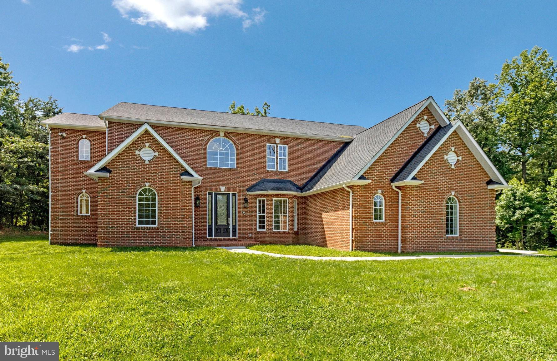 All-brick 7 Bedroom, 5.5 Bathroom colonial with over 5,000 sqft of beautifully finished space - an unmatched gem in the neighborhood! This breathtaking showstopper boasts a 3-car garage, TWO convenient main-level bedrooms one with full bath and one with half, and a versatile bonus room. The open-concept kitchen and family room feature soaring ceilings, sleek updated finishes, a double oven, and three spacious pantries - ideal for the home chef and effortless entertaining. Bright and airy, the kitchen flows seamlessly into the expansive family and adjoining dining rooms, creating the perfect backdrop for gatherings large and small. Generously sized bedrooms, a balcony from the master, and abundant storage throughout offer comfort and convenience for every lifestyle. Set on a meticulously landscaped 1.8-acre lot with mature trees and ample outdoor space to relax or play. Enjoy unbeatable access to Route 50, I-495, and the BW Parkway, plus nearby shopping, dining, and parks. This rare find won’t last—schedule your showing today and experience true luxury living!