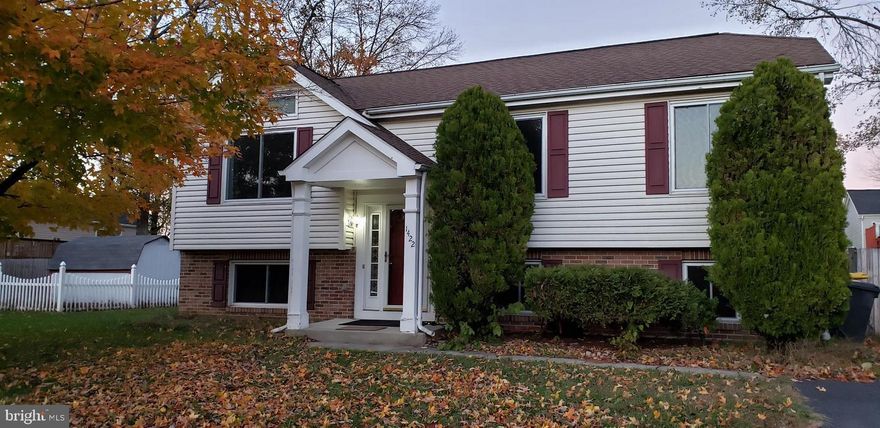 Spacious 4 BR, 2.5 BA Split Foyer home with 2 finished levels on a quiet street located in Harmans Woods. The upper level has tall windows and a cathedral ceiling which allow plenty of natural light to fill the space. There are 3 nicely-sized bedrooms ustairs . Lower Level Includes Master Suite w/ Attached Bath and Bonus Family Room. Large Rear Deck and Fenced Yard are Perfect for Entertaining!