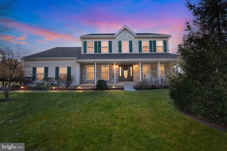 Welcome home to this exceptional four-bedroom residence in Collegeville’s highly sought-after Starfield community. A charming wraparound front porch spans the stone-front exterior, offering the perfect setting for morning coffee or relaxed evenings at home.

Inside, a dramatic two-story foyer with hardwood floors sets the tone, flowing throughout much of the main level. To the left, the formal dining room features crown molding and chair rail, creating an elegant space for hosting memorable gatherings. To the right, the formal living room opens directly to the porch through sliding doors, seamlessly blending indoor and outdoor living.

At the heart of the home is the spacious kitchen, thoughtfully designed with stainless steel appliances, a center island, pantry, and generous eat-in area. The kitchen opens effortlessly to the family room, where a soaring cathedral ceiling and cozy fireplace create an inviting space for both everyday living and entertaining. A first-floor office provides flexibility for remote work or study, while a powder room and laundry room with utility sink complete the main level.

Upstairs, four well-appointed bedrooms and a hall bath await. The primary suite is a true retreat, featuring an expansive custom walk-in closet and a spa-inspired en suite bath with cathedral ceiling, soaking tub, walk-in shower, and dual vanities.

The finished basement adds even more living space with a large recreation area and built-in bar, along with an unfinished room ideal for storage. Outside, enjoy a patio just off the kitchen, a backyard shed, and mature trees that provide privacy and a tranquil setting.

Located in the award-winning Spring-Ford Area School District, this home is just two miles from Providence Town Center—home to Wegmans, Movie Tavern, and a variety of shopping and dining options—and minutes from Route 422 for easy access to the Philadelphia Premium Outlets, King of Prussia, and beyond. This is Starfield living at its finest.