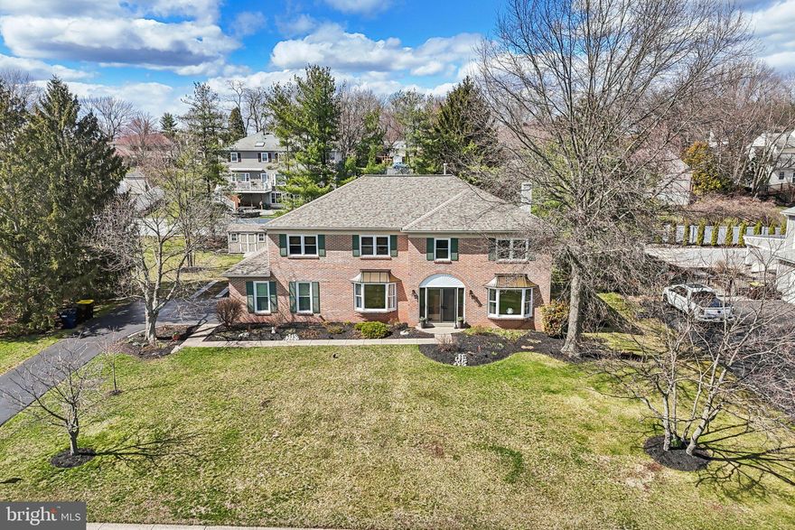 Welcome to this desirable brick two-story Colonial in the highly sought-after Gwynedd Shires community. This beautifully maintained home makes a lasting first impression with its grand double-door entry and soaring two-story foyer featuring updated flooring. The formal living and dining rooms flanking the foyer showcase hardwood flooring, providing elegant spaces ideal for entertaining. At the heart of the home is a stunning, custom-remodeled eat-in kitchen designed for the gourmet chef. It features granite countertops, a center island, stainless steel appliances, a new wall oven and dishwasher, and a gas cooktop with a vented exhaust hood. Just off the kitchen, the inviting family room is highlighted by a brick wood-burning fireplace and custom built-in bookcases. Hardwood flooring flows throughout much of the first floor, which also includes a newly remodeled powder room and a convenient mudroom with laundry and additional storage. The oversized two-car garage directly accesses the mudroom. The second floor features an expansive primary suite with hardwood floors, vaulted ceilings, and ample space for a sitting area, home office, or fitness setup. The oversized 12x12 walk-in closet offers exceptional storage, while the private, remodeled ensuite bath serves as a spa-like escape with a Kohler deep soaking tub and a glass-enclosed shower with body jets. Three additional generously sized bedrooms and a beautifully remodeled hall bath complete this level. The professionally waterproofed basement offers excellent potential for finishing or abundant storage. Additional features include efficient gas heat, central air conditioning, and Verizon Fios availability. Significant updates include a new roof (2022), new windows (2022–2025), brick pointing (2021), and freshly painted exterior trim. Outdoor living is equally impressive, featuring an expansive deck, a garden shed, and a beautifully landscaped, fenced backyard with mature trees and perennials. Ideally located within the North Penn School District, this property offers easy access to Routes 363, 63, and 73, and is minutes from the PA Turnpike. This is a Must See - Make your appointment now for a Tour. Showings Start Monday 03/23