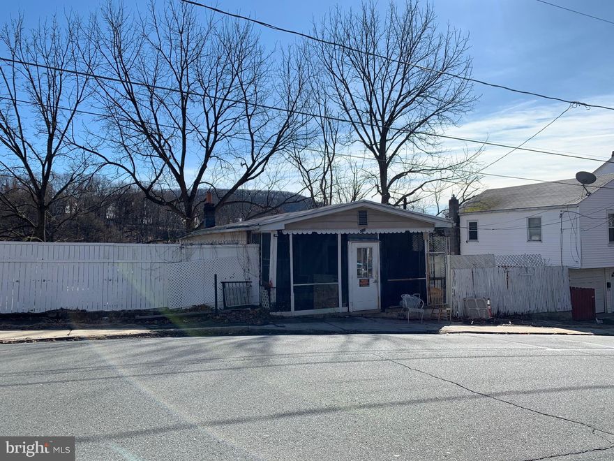 Investor Special - Single family bungalow/raised ranch on a larger lot with potential.  Some of the work already started - new carpet in the living room and first floor bedroom as well as new flooring in the kitchen.  First floor offers a nice sized living room, large kitchen, bedroom and full bath. Downstairs is another bedroom, half bath and large family room/work room area with separate entrance.