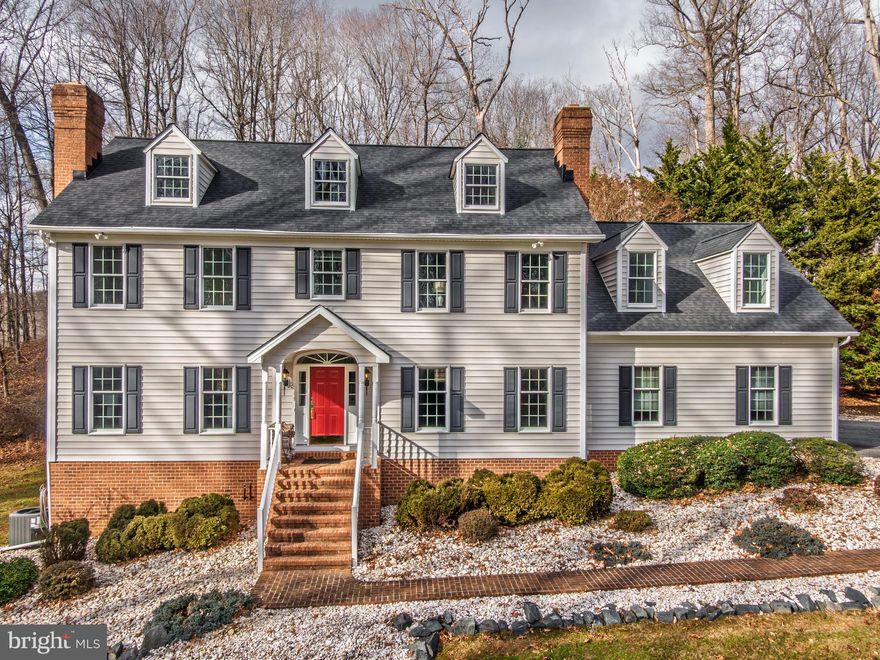 Welcome to 11112 Old Carriage Road located in Glen Arm, Maryland, in the highly sought after Honeysuckle Hill neighborhood, where there is no HOA. ----- This beautiful custom home was built in 2000, has over 4600 sq. ft. of living area, sits privately on 3.23 acres backing to Loch Raven Reservoir and offers water views from the southeastern side of the home. The 550-foot private driveway creates a picturesque setting for this stately home. ----- Perfectly designed for idyllic living, this home features four bedrooms, four and a half baths, a two-story foyer, two wood burning fireplaces, nine foot ceilings on the first floor, beautiful hardwood floors, custom trim, recessed lighting, an oversized two car garage, a gourmet kitchen, two staircases to the second floor, a home office, two heating and air systems, silent floor construction, beautiful chandeliers, a central vacuum system, ceiling fans in every bedroom and family room, a finished lower-level recreation room, and so much more. ----- Additional home features include: 2x6 exterior wall construction, Anderson windows throughout with a 3M window film for UV fade protection, interior doors appointed with Baldwin hardware throughout the home, an architectural shingle roof installed August 2020, dual-zoned oil over heat pump HVAC systems installed May 2023 and serviced by two 275 gallon oil tanks, a 12 foot wide 551 foot driveway newly paved July 2025, and a freshly painted interior November 2025. ----- Neighborhood highlights: Glen Arm, Maryland is a scenic and rural community in Baltimore County and is known for its historic farms and beautiful landscapes. ----- 
The home is approximately a 10-minute drive to the Baltimore Beltway 695, approximately 20 minutes from two of the country’s top hospitals: GBMC and St. Joseph, approximately a 30-minute drive to downtown Baltimore and about a one-hour drive to Washington, DC. ----- You'll also find within a 10-minute drive great shopping at stores like Whole Foods and Sprouts, the Towson Towne Mall, great restaurants, and more. ----- Last but certainly not least, if you like to walk, hike, run or bike, you’re minutes away from Lock Raven Reservoir where trails seem endless, and fishing is fun! *****Please see Open House Scheduling! Friday evening's Open House on February 6th from 5-7 is PRIVATE and by RSVP only, have your agents register you for this private event (lite fare and refreshments will be served).*****