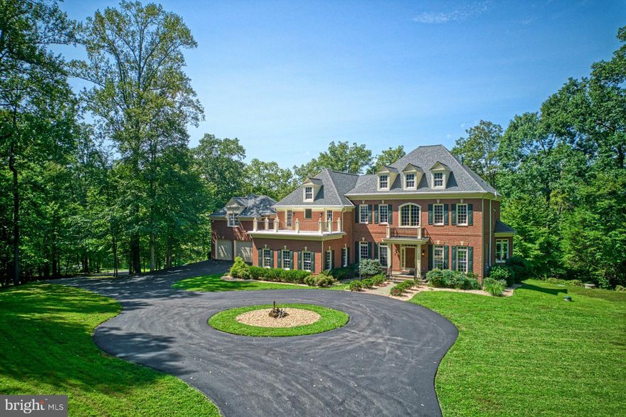 Significant Price Improvement! Spectacular Waterfront Estate on Sandy Run with Access to the Occoquan Reservoir. 

Don’t miss this rare opportunity to own a breathtaking all-brick estate with over 10,000 finished square feet, perfectly positioned on Sandy Run with direct access to the Occoquan Reservoir.

Enjoy a serene waterfront lifestyle with a natural path leading to the water—ideal for kayaks, paddle boards, canoes, jon boats, or a small pontoon. With a 10-horsepower motor limit on the Reservoir, peace and quiet abound, and fishing enthusiasts will love the abundance of largemouth bass, catfish, bluegill, crappie, and perch.

Inside, the home offers more than 6,800 square feet on the top two levels alone, with stunning water views from nearly every room across the back of the house. The main level features a spacious kitchen that flows into the breakfast and family rooms, plus elegant formal living and dining rooms, a private office, and a sunroom. Outdoor living shines with a screened porch, main deck, and a private deck off the office—all overlooking the water.

Upstairs, the luxurious primary suite feels like a retreat, complete with a sitting room overlooking Sandy Run, two walk-in closets, a spa-like bath with a soaking tub and oversized shower, and a private deck with views of the wooded front yard. Three additional bedrooms and two full baths complete this level.

The finished lower level is designed for entertaining, with a rec room, theater room, exercise room, bedroom, and full bath—all opening to a large masonry patio with a fire pit, perfect for year-round gatherings.

A detached two-car garage with finished living space above offers privacy for guests or an ideal home office, featuring a full bath, kitchen area, and expansive open space. The attached garage, connected by a covered portico, provides additional convenience.

This extraordinary property is truly one of a kind—an elegant all-brick custom home on the water with exceptional living space, tranquil views, and access to the Occoquan Reservoir. Welcome home!