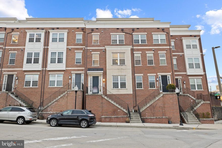 STUNNING FOUR-STORY CUSTOM HOME NOW AVAILABLE IN THE HEART OF FEDERAL HILL WITH OVERSIZED 2 CAR GARAGE PARKING AND 2 CAR OFF STREET PARKING PAD. 2400+ SQ FT. GLISTENING HARDWOODS CASCADE THROUGHOUT. ENJOY CUSTOM CABINETRY, UPGRADED TRIM, IMPORTED TILE, QUARTZ COUNTERTOPS, FRAMELESS GLASS SHOWERS, HIGH END SS GE APPLIANCE PACKAGE IN DESIGNER CHEF'S KITCHEN WITH GIGANTIC 10 FT ISLAND AND PRIVATE BALCONY. TWO GAS FIREPLACES. LOADS OF NATURAL LIGHT. HIGH CEILINGS. TONS OF STORAGE. WALK-IN SHOWERS. CUSTOM BUILT INS. CUSTOM BLINDS. FULL HOME SECURITY SYSTEM. SPACIOUS 3 BEDROOMS WITH 5 TOTAL BATHROOMS. 2 MASTER SUITES. 4TH LEVEL INCLUDES FULL WET BAR AND CAN BE USED AS A LOFT, PLAYROOM, OFFICE, OR ADDITIONAL 4TH BEDROOM. EXPANSIVE WALKABLE DECK WITH GAS FIREPLACE - DUAL USE INDOOR/OUTDOOR. INCREDIBLE WATER AND CITY VIEWS OVERLOOKING THE HARBOR - GREAT FOR ENTERTAINING. CLOSE PROXIMITY TO RETAIL SHOPPING, LOCAL DINING, STADIUMS, INNER HABOR AND ALL MAJOR HIGHWAYS. SCHEDULE A PRIVATE TOUR TODAY.