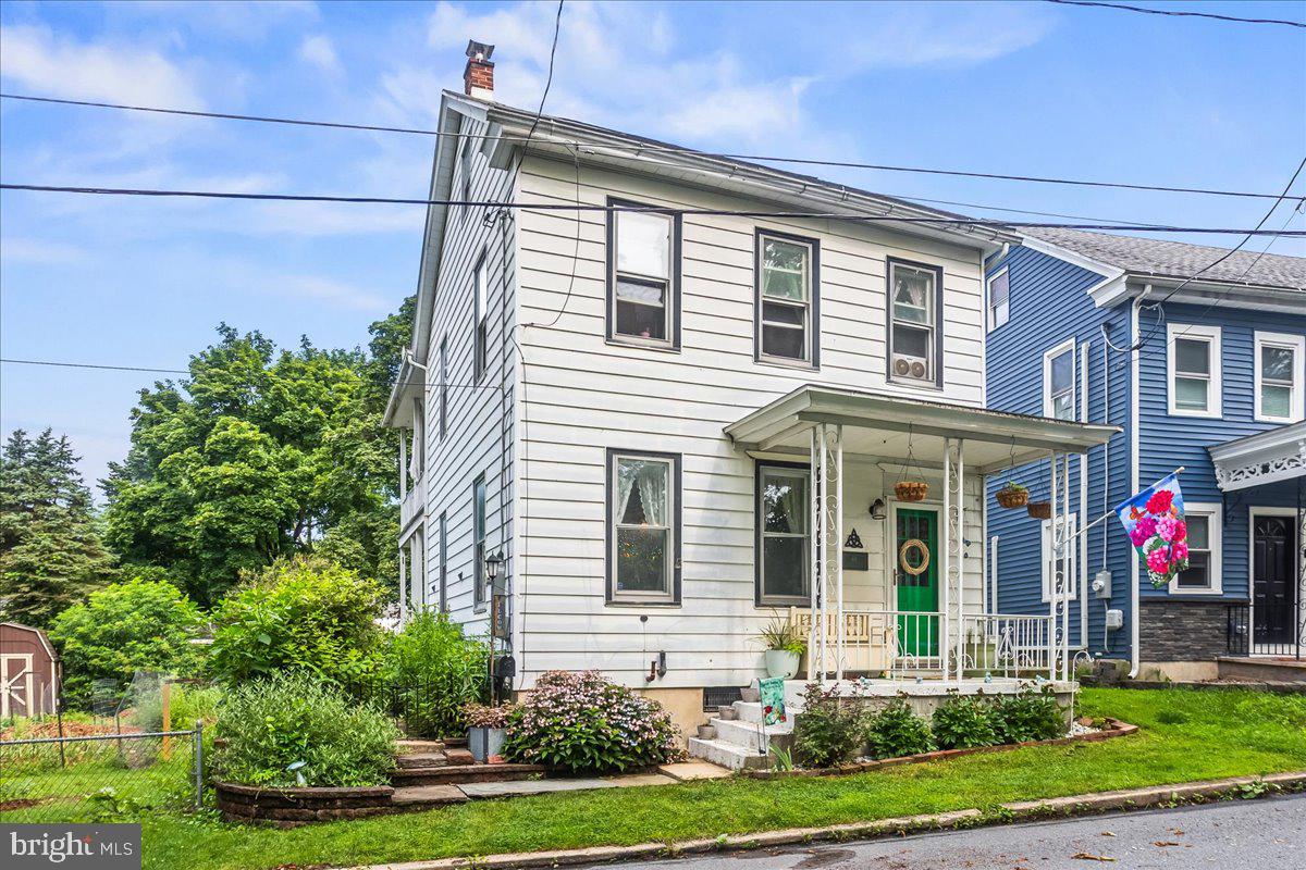Move-in ready and charming as heck! You enter from the front porch to a spacious living room with dining area. A sizable eat-in kitchen with dishwasher and laundry area (no hauling your laundry to the basement!) round out the first floor. Upstairs, you'll find 3 good-sized bedrooms. Enjoy the views of the park across the street from the balcony off of the primary bedroom. Two other bedrooms and the full bathroom complete the second floor. More features include a walk-up attic, replacement windows, full basement, front and side porches, a chimney liner added in 2019, fenced yard, side-porch off of the kitchen and a shed. This cute home is just across the street from the idyllic Union Canal and adjoining park and down the street from the Pine Grove Community Pool.