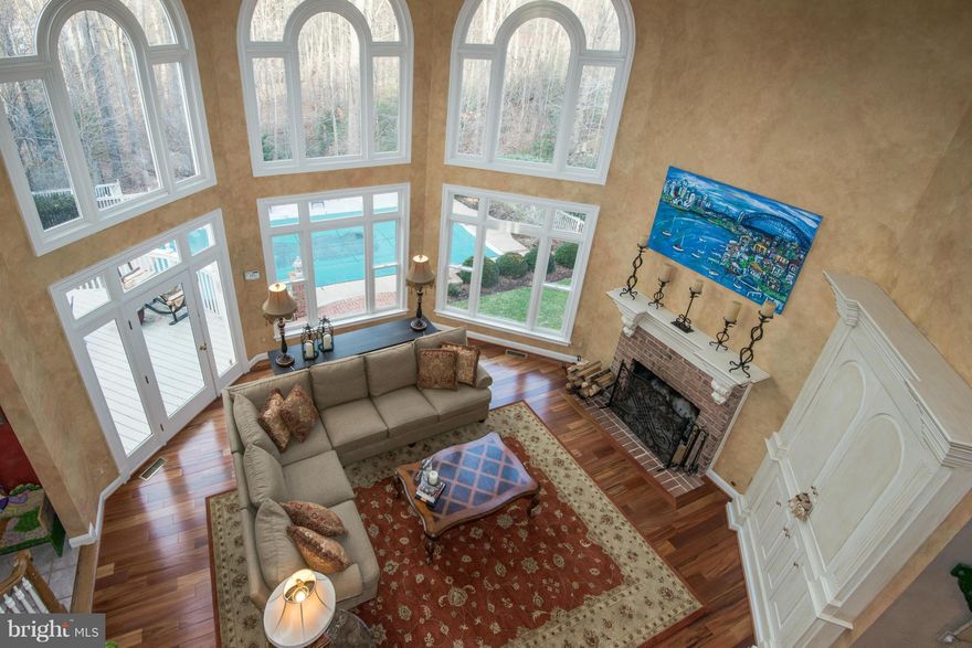 Stunning home in sought after community,1.72 acres on cul de sac. Circular drive with brick inlay brings you to a light filled home with unique architectural and designer details, beautifully maintained. Palladium windows, exquisite molding,faux paint,hdwd floors. Pool & decking overlook a treed lot that makes this perfect for barbecues/elegant entertaining. Fun HOA community events. Ideal living!