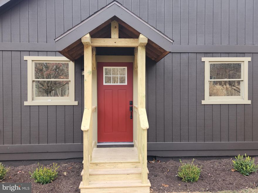 Cute as a button, this 3 bed 2 bath saltbox style cabin has been reborn into the Mountain Escape you have been looking for.  If the charm doesn't initialy strike you, the renovations will.   Inside you are greeted with an open floor plan, vaulted ceilings, and lots of windows that fill this home with heart and warmth.  The main living area will meet your needs with a brand new kitchen including hickory wood cabinets, new counter tops, oversized farm sink and black stainless steel appliances.  You will never be chilly with the wood burning stove that will be sure to keep this 1372 sq. ft. cabin toasty warm on the cold winter nights. The main level also includes the master bedroom and fully remodeled attached bath.  The sliding doors either in the living room or off the master suite make it a convenient way to access the newly built wrap-around deck.  

On the second level you will find  2 nicely sized bedrooms with a Jack and Jill style bathroom.  New LVP flooring and carpet throughout the home add to the list of many upgrades making this home low maintenance for years to come.  Included in recent upgrades includes electrical, lighting, and plumbing fixtures, new doors, and all freshly painted inside and out.

Outside from your new 500sq.ft. wrap around deck, you will be over looking 3 acres of private wooded land.  The yard includes a large fenced in garden with raised beds, ground plot areas, and fully netted run for growing berry bushes; all surrounded by a variety of fruit trees.   You will have plenty of storage and outdoor workspace with 3 sheds that have electric.  You will find all of this within an easy scenic drive only 13 miles from the beautiful downtown area of Berkeley Springs.  Don't miss this opportunity to own a piece of WV, this one will go quickly! 
Seller is Agent.