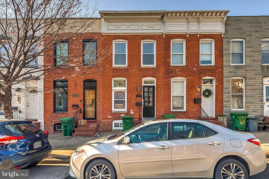 CHARMING HOME LOCATED IN THE HEART OF CANTON - located just two blocks from the Canton Square and a few blocks to Patterson Park this home features an open floor plan with hardwood floors throughout, exposed brick, crown molding, decorative fireplace and an updated kitchen with granite countertops, ss appliances and breakfast bar leading to convenient main level half bath &  private rear patio.  Upper level offer two spacious bedrooms, convenient center hallway bathroom with separate tub & shower and full basement great for storage - freshly painted and new carpet installed, affordable Canton living at its best!