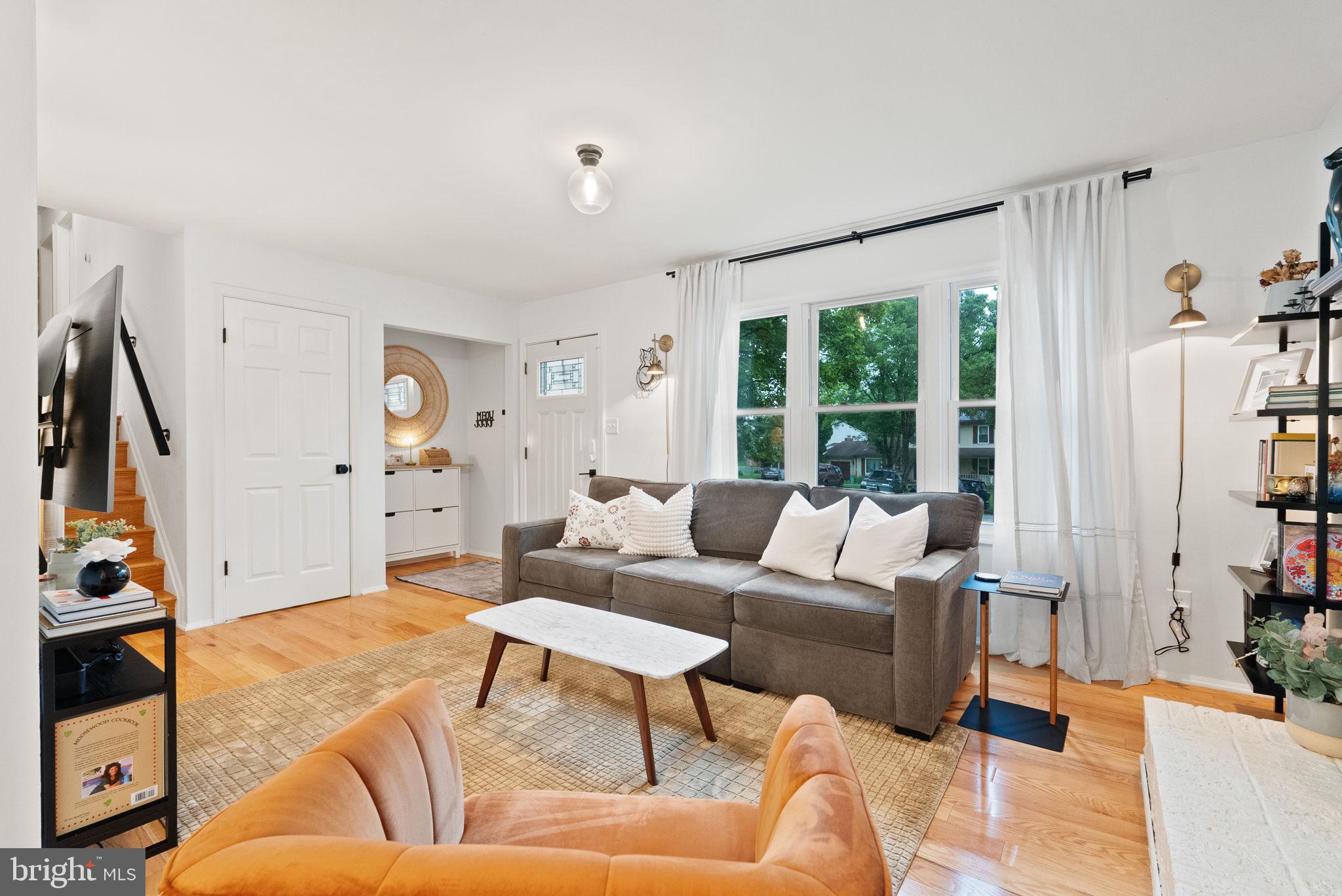 Craving a tranquil retreat with seamless access to urban conveniences? This beautifully updated 4-bedroom, 3-bath split-level home offers serenity with modern flair! Set on an 8,241 sq ft lot within a peaceful cul-de-sac in the popular Cheverly neighborhood, its warm brick façade is framed by vibrant greenery. Gleaming hardwood floors, neutral hues, and designer fixtures create a welcoming ambiance inside. The living room, bathed in natural light from wide windows, highlights a classic brick fireplace before smoothly flowing into a dining alcove where glass sliders open to your patio.
The adjacent kitchen is a culinary delight, with stainless appliances, ample cabinetry, a chic backsplash, and luminous countertops. A pass-through window adds a touch of elegance, making entertaining effortless. Your generous primary suite includes a contemporary ensuite with a walk-in shower, providing a personal sanctuary.
The versatile lower level features a comfortable bedroom, full bath, recreational area, exterior entry, and a bonus room —ideal for multi-generational living. Relax in your backyard surrounded by mature trees, perfect for alfresco meals or weekend BBQs. Notables include a utility nook, detached storage shed, and a multi-vehicle driveway. The property comes equipped with a water filtration system and updates.
With its proximity to parks, schools, major highways, and public transit (including metro trains and buses within a mile), you’ll enjoy shopping in nearby Landover or Ardwick. The home is within walking distance of the town center’s neighborhood farmers market, which runs every other Saturday from spring through the fall. With multiple clubs and social groups in the neighborhood, ranging from gardening to social services, you’ll never be without activities to partake in. Additionally, Baltimore, Arlington, and Philadelphia make for easy day trips, while Washington, D.C.’s dynamic nightlife is just a short drive away. Come experience the harmonious lifestyle that awaits you!