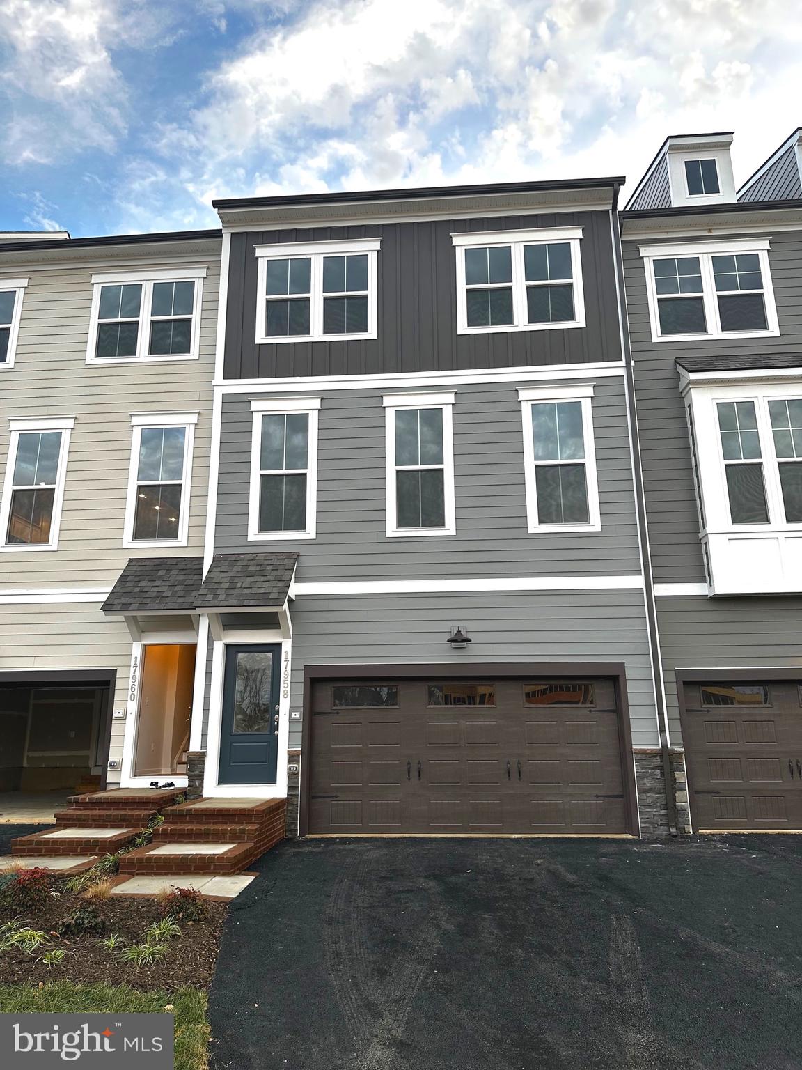 Gorgeous Stanley Martin 4 Level Luxury Townhome in desired potomac Shore February  MOVE IN! Over 3,200 square foot property offers 4 bedrooms, 4.5 bathrooms, and an oversized two-car garage. Feel welcomed to an open floor plan layout where living, dining, and gourmet kitchen are combined into one open space that is excellent for entertainment. The kitchen features a large quartz island and countertops, arabesque design Italian marble tile backsplash, Sonoma Timberlake wood cabinetry, a large sink bowl, and a chef-style faucet. The high-end GE Profile stainless steel appliances include a French door fridge, five-burner gas cooktop. The king-sized Main bedroom has two large walk-in closets and a stunning bathroom with quartz countertops and a frameless glass door shower. The home also features lots of windows, oak stairs in all levels; a dual-zoned HVAC system to set the desired temperature in separate floors; fourth level loft with full bath and 2nd patios amazing view over Potomac River. Home and community amenities include Free Verizon Fios internet - 1 Gigabit data at home; a state-of-the-art gym, a movement studio, a yoga garden at the community fitness center; an eight-lane competition pool with amphitheater-style viewing; sports courts, parks, and walking trails; and discounted rates offered for Jack Niklaus-designed golf club. A short driving distance from the new Covington-Harper Elementary School's advanced campus, brand new STEM-oriented Potomac Shores Middle School, and prestigious Saint John Paul the Great Catholic High School. Also conveniently located minutes from I-95, close distance from future VRE station being built and an easy 20-min car ride to Quantico Marine Corps Base. .