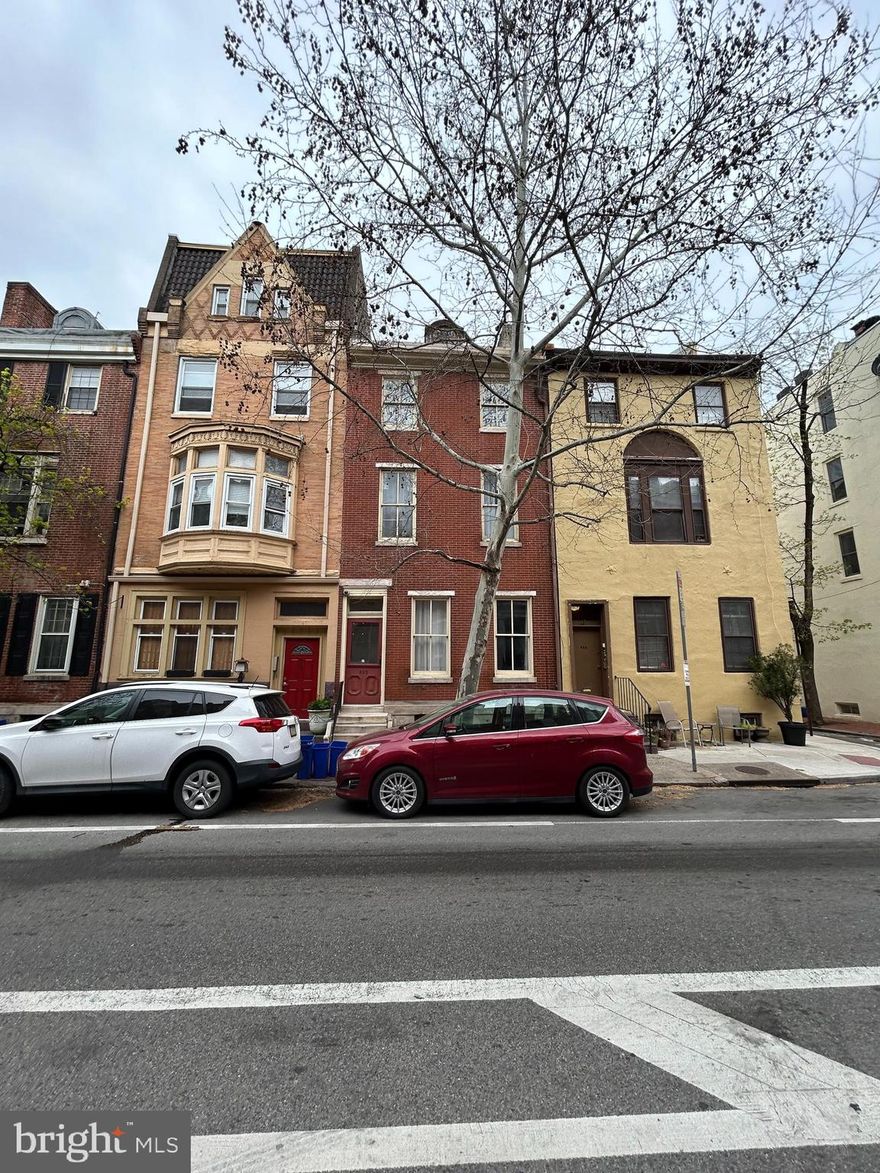 OFFER DEADLINE: 12pm Monday 10/6.

Investor opportunity in prime Washington Square West - 3 unit multi-family townhouse with 2-car parking. 

Located in the heart of Washington Square West, this 3-unit multi-family townhouse presents a rare investment opportunity with 2 off-street parking spaces, strong rental potential and value-add upside. Just steps from Center City amenities, this property is ideal for investors looking to add a high-demand asset to their portfolio in one of Philadelphia's most walkable and desirable neighborhoods.

Property Layout:
Unit 1 (first floor): 1-bedroom, 1-bath flat featuring hardwood floors, large basement, in-unit laundry and access to a rear patio/parking pad. Bedroom in need of renovations due to recent fire on unit above.

Unit 2 (2nd floor): 1 bedroom, 1 bath unit with deck in need of major renovation due to recent fire damage. 

Unit 3 (3rd floor-Bi-level): 2 bedroom, 1 bath unit spanning two levels. Features include an open-concept living/dining space, updated kitchen and top-floor lofted bedroom/office space well-suited for a premium rental or future owner-occupant.

The building is separately metered for electric and has a strong rental history and area comps. This property is perfect for an investor looking for a project with high ROI, immediate value-add potential and long-term appreciation in one of Philly's top neighborhoods. Bring your contractor and your vision to restore this home and unlock the full potential of this Washington Sq W asset.