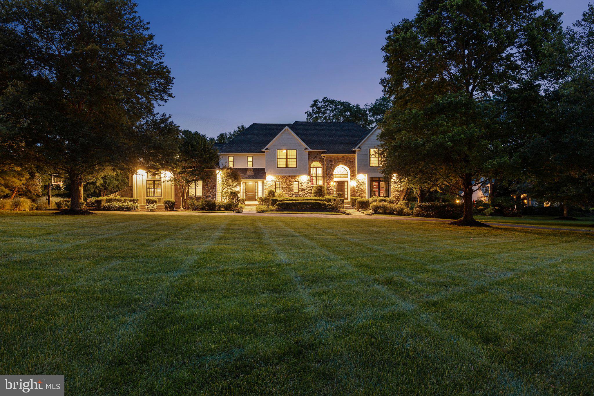 Extraordinary example of design, elegance, attention to detail and meticulous workmanship from Rock Hill Custom Builders, situated in one of Upper Makefield township's most desired neighborhoods…Weatherfield! A governors' driveway encircles in front of the property with a blue flagstone walkway leading to the main entrance. Step inside the foyer area that features a large greeting space with gleaming hardwood floors and detailed millwork. Flanked to the right of the foyer is the first floor study with upgraded stained cherry wood paneling, built-ins and moldings. A few more steps forward in the foyer are both the formal living and dining rooms. Both offer additional millwork with a propane gas fireplace in the living room and a decorative tray ceiling in the dining room. Perhaps the most enjoyed place of any home is the kitchen and great rooms. Much time is spent in both places and the space at 7 Weatherfield Drive won't disappoint. The kitchen was featured in Houzz Philadelphia Region Kitchen Renovations website/magazine and which includes Sub Zero refrigeration and freezer, refrigerator drawers, Fisher Paykel and Asko diswashers, Wolf Range and microwave, walk-in pantry & reverse osmosis drinking water faucet. The butlers pantry includes Sub Zero Wine Refrigeration and bar sink. Also, the light drenched breakfast room has walls of windows and a gorgeous Swarovski Crystal Chandelier that remains with the house. Adjacent to the kitchen is the elegant great room with coffered ceiling, custom built-ins, HW flooring, recessed lighting and a floor to ceiling field stone fireplace with raised stone hearth. There is also an additional covered front entrance that adds architectural balance to this classic colonial design. A first floor laundry and beautifully appointed powder that complete the main level. There are two staircases that lead to the second floor. Upstairs is the primary bedroom complete with gleaming hardwood floors, raised volume ceiling, walk-in closet and an absolutely "jaw-dropping" beautiful bathroom with full glass enclosed shower, soaking tub and heated marble flooring. There are an additional 4 bedrooms, two full bathrooms, and one additional guest room/Bonus space all located on the second level! Below is the finished walkout basement with large recreation room, craft area that has an enormous counter top, home gym area, a music room, cedar closet and plenty of storage space. The outdoor oasis features maintenance free deck, paver patio, invisible dog fence, 10 zone irrigation system. Other home highlights include simply safe home alarm system with motion, water and video, whole home 17KW self start generator, New Hardie plank siding (10yr Warranty), New Marvin windows, New Anderson doors, New front doors (All in 2023). Roof replaced in 2014 featuring Camelot Architectural Shingles (Lifetime Warranty). New Epoxy garage floor (2024). This Weatherfield neighborhood is a special place and the HOA has an annual block party every September! Conveniently located to all major commuting routes including transportation to NYC and PHL. Award winning Council Rock School District including CR North HS. Don't miss out on this fabulous opportunity!!
.