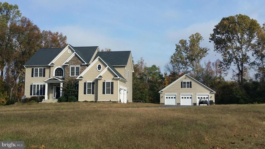 5 bed, 3 1/2 bath house on 1.28 acres. Fully finished basement features second kitchen. Granite countertops in kitchen and all bathrooms, gourmet kitchen w/ stainless steel appliances, hardwood throughout, show stopping stone floor to ceiling fireplace. All offers are subject Lender's review and approval.