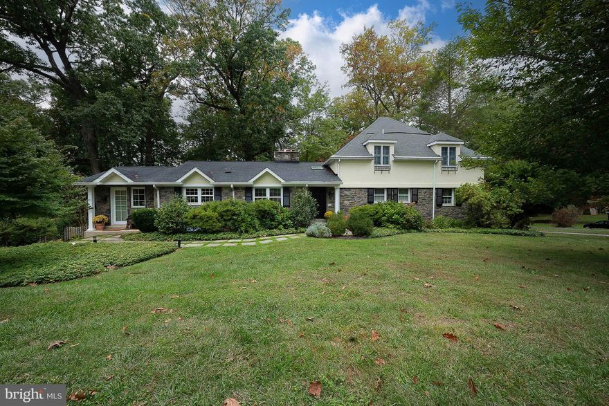 Nestled on a quiet cul-de-sac in the sought after Radnor Township is this beautiful home featuring 5 Bedrooms, 5 Bathrooms situated on a 1.21 acre lushly landscaped lot. You are welcomed into the home with a beautiful Foyer with hardwood floors and a gracious side staircase with a large skylight. Enjoy entertaining guests in this large combination Living Room and Dining Room with hardwood floors. The Living Room area has a wood-burning fireplace and the Dining Room area has stunning built-ins to display your collectibles. French doors open into a light filled enclosed Sunroom.  Views from all sides of the indoor Sunroom where you can sit and relax to admire the 4 seasons of the year.  Back in the Foyer to the left is a handsome Family Room with built-in bookshelves along one wall, beamed ceiling and a wood-burning fireplace which opens into the Kitchen. The Kitchen boasts an eat-in area with built-in seating around the table and a step down to a welcoming Mudroom. 
The Foyer leads to a hallway with a Hall Bath and 3 generous sized Bedrooms, one with an En Suite Bathroom. There is also a Library/Office with plenty of built-ins for all of your literature. 
The stairs lead up to a second floor which was added several years ago. This area opens into a Loft with beamed ceilings, built-ins, a sky light and a cedar closet. The Primary Bedroom has a cathedral ceiling with beams, a walk-in closet and built-ins. The Primary Bathroom has a double vanity with a tub/shower. There is an additional Bedroom and Hall Bathroom with a skylight. 
The walk-out Lower Level is equipped with a potential Au Pair/In-law Room plus a full Bathroom with a stall shower. There is an extra large Recreation Room with built-ins. From there you can walk to an outdoor Patio with a sitting area where the trees surround the back of the house, making any season a pleasurable place to sit and relax. From there, you can walk to the pool . Back inside you will find a spacious Laundry/Sewing Room as well as access to the Two-Car Garage with ample space to extra storage or bicycles/sports equipment. 
Outside you can enter through a charming gate to reach the most inviting in-ground pool with multiple seating areas to soak up the Summer sun. The pool is surrounded by trees and gardens which are a perfect place to relax and have a wonderful get together. There is also an attached heated spa in the pool with all of the connections to the pipes for the gas supply to heat if you wish to connect. Beyond the pool is a large yard  surrounded by mature trees. The perfect spot to play, relax or to take in the the serene outdoor space. 
Located in the award winning Radnor School District, this home is close to downtown Wayne with its local shops and restaurants, public transportation, Center City, Medical centers, the Airport and major highways. This home offers an amazing school district, a wonderful neighborhood, abundance of entertaining space and is truly a must see!