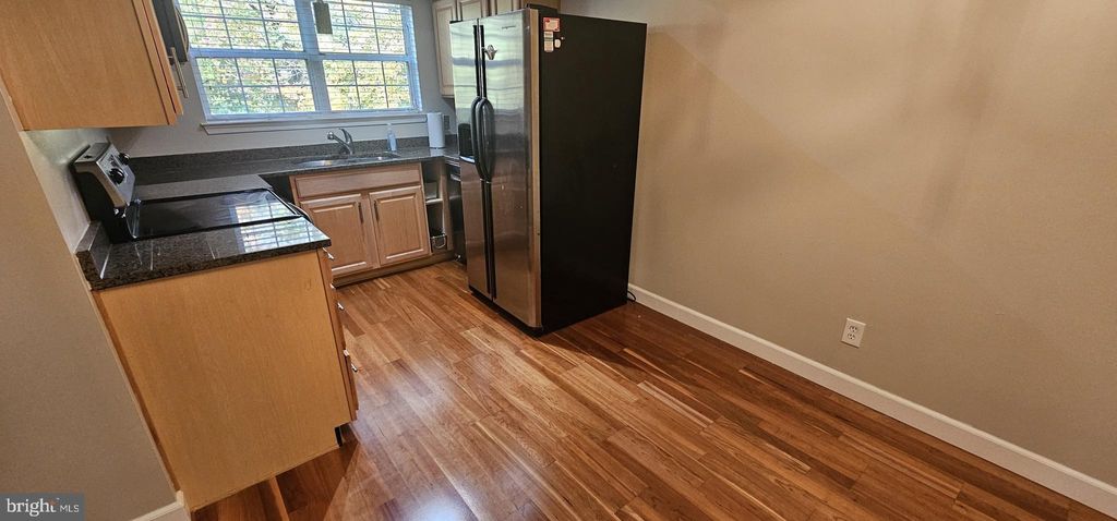 Photo of 12012 Golf Ridge Court #102, FAIRFAX, VA 22033 (MLS # VAFX2277234)