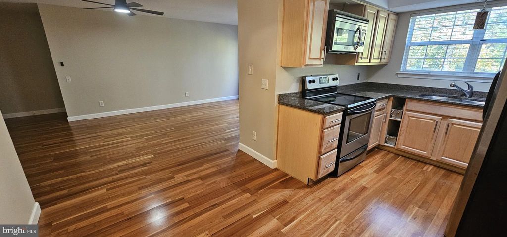 Photo of 12012 Golf Ridge Court #102, FAIRFAX, VA 22033 (MLS # VAFX2277234)