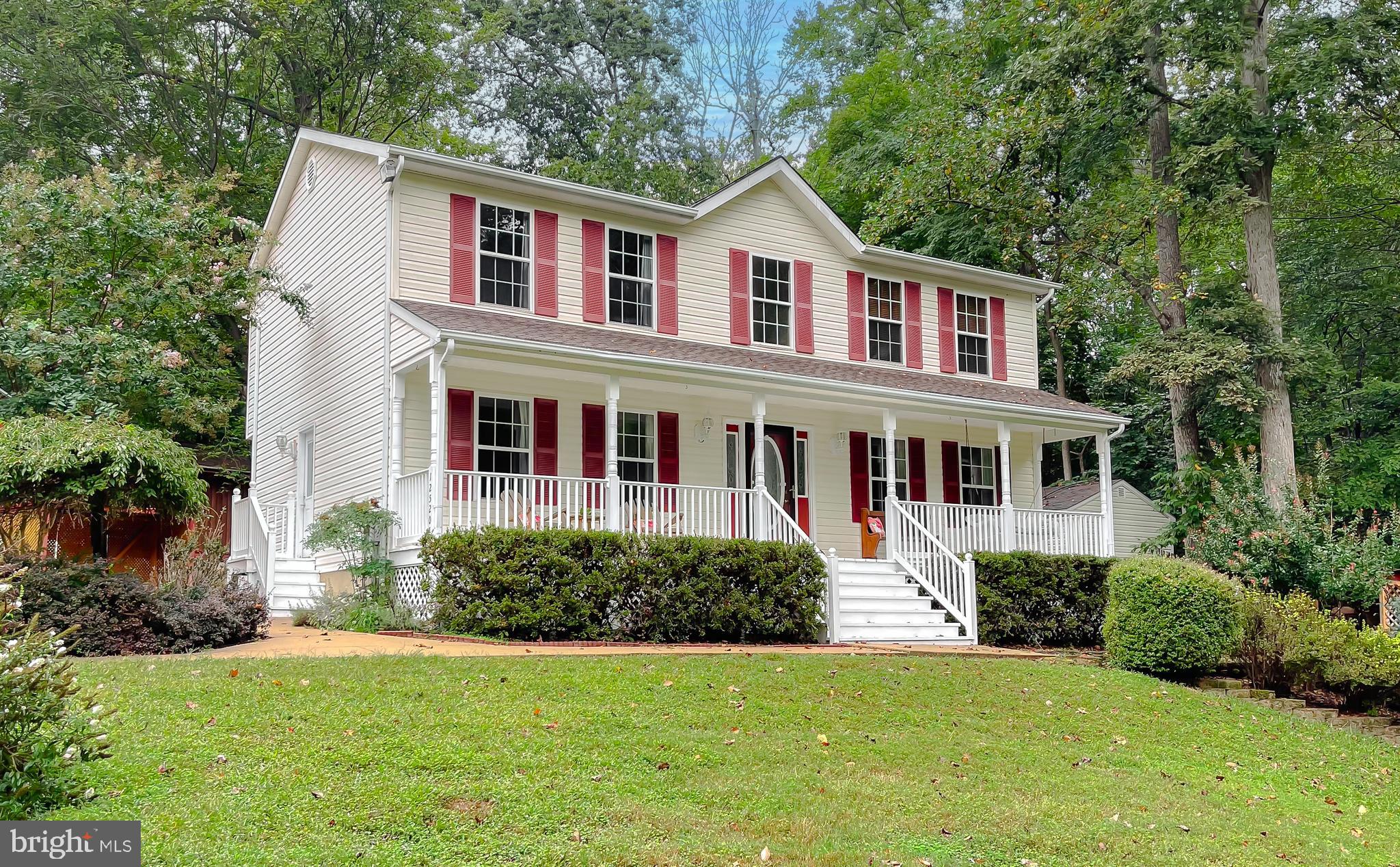 Step into this charming Colonial with new roof and new septic system with BATT completed. Be captivated by its stunning front porch, the perfect spot to unwind and take in breathtaking views of the Bay! Time will slip away as you soak in the serene scenery. The backyard is an entertainer's dream, featuring a spacious deck with a pergola and a large shed for all your storage needs. Picture yourself gathered around a fire pit, creating memories during dinner or extending your outdoor season. There’s even space for raised garden beds to grow your own fresh spring and summer produce! Inside, the open-concept main level flows seamlessly with gorgeous hardwood floors and exquisite built-in cabinets in the formal dining room. The expansive family and living rooms are designed for comfort, complete with a wood stove that brings warmth and coziness to the entire space. Upstairs, you’ll find generous bedrooms, including a primary suite with water views to wake up to every morning. When the weather is right, open the window and hear the waves crashing on the bay! Plus, enjoy exclusive beach access through the community’s private beaches that lead right to the Bay and Lake—ideal for fall days by the water. Come see!