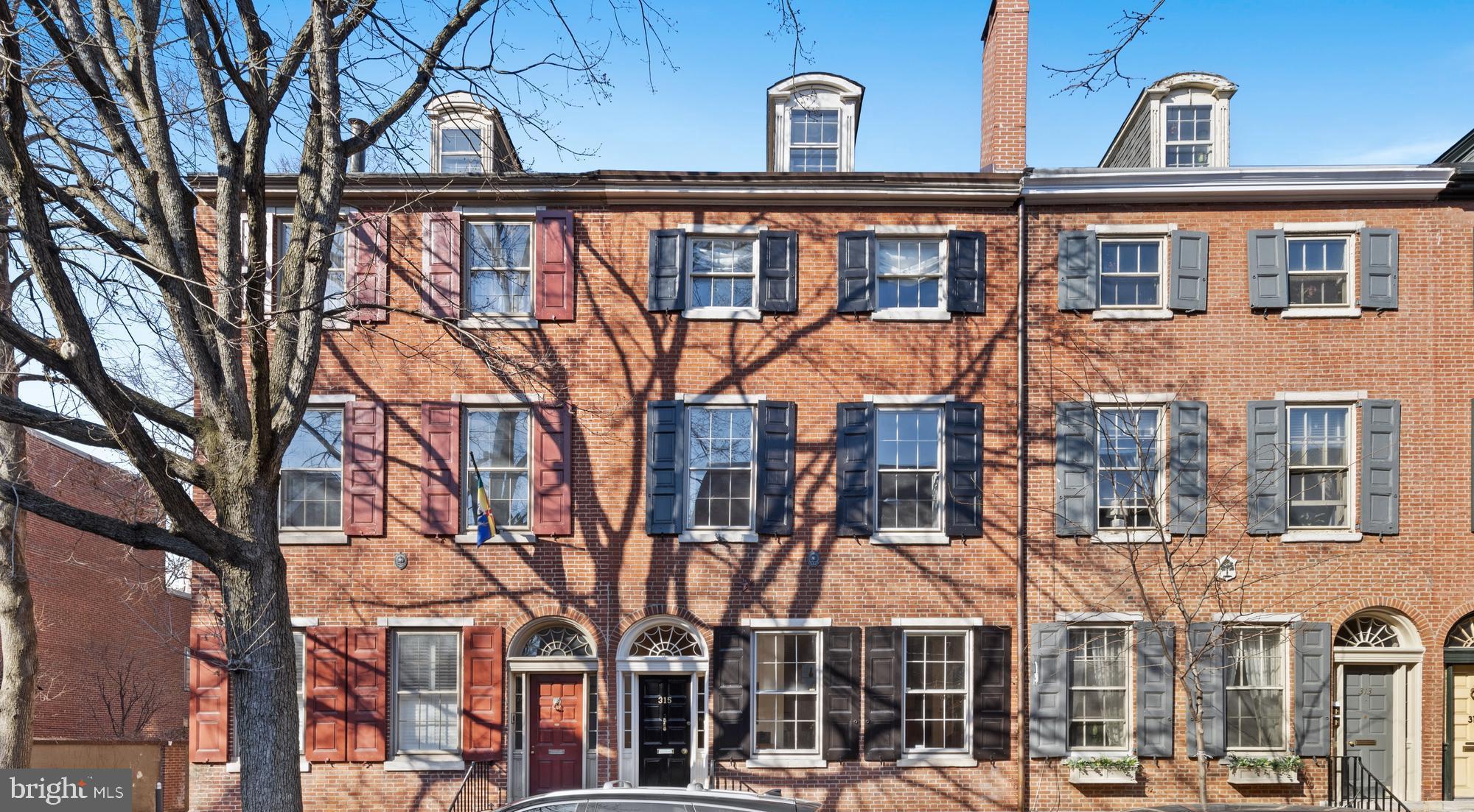 Enjoy this amazing opportunity to live in Society Hill with two separate buildings on one lot. This home offers more than 4,000 square feet of living space across two separate houses, plus a deeded parking place, a lovely garden and a private elevator. This historic Society Hill showplace is one of the most unique properties available in Philadelphia today. Built in 1815, this property combines classic historic detail with contemporary finishes, making this a unique opportunity for those seeking a spacious compound, multigenerational accommodations or additional rental income. The five-bedroom, three-and-a-half-bathroom primary residence greets you with lovely hardwood floors, soaring 12-foot-tall ceilings and stately millwork. On the main level, entertain in the dining area or relax in the adjacent sitting room featuring an open view and pass-through window to the lower-level kitchen. Chefs will love the cherry glass-front cabinetry, soapstone counters and upscale stainless-steel appliances, including a Sub-Zero refrigerator and two Dacor ovens. Ascend the staircase to enjoy a spacious living room where expansive windows usher in stunning sunlight. Upstairs, the full-floor owner's suite dazzles with a cozy sitting area, built-in cabinetry, a large bedroom with two closets and an en suite bathroom featuring classic marble and subway tile. Two more bedrooms share a bathroom on the third floor, that last stop on the elevator. The fourth floor includes two more bedrooms, with new HVAC wall units, that share a brand-new bathroom. In the equally charming three-story rear house, you will find two spacious bedrooms, two full bathrooms, a large living room and a galley kitchen. Tall ceilings and hardwood floors run throughout, and the basement area includes a washer-dryer. A separate entrance and private patio through a secure gate makes this abode ideal for rental use. Relax in the fabulous outdoor space and enjoy the rarest of city conveniences: a deeded parking space on 3rd Street included in the annual $1400 HOA fee. Positioned in the heart of coveted Society Hill, this home is just inches from glorious outdoor space, including Three Bears Park, Washington Square, Independence National Historical Park and the waterfront. Fantastic dining, nightlife, shopping and top-rated schools line the nearby streets. With excellent walk, bike and transit scores, this historic neighborhood is as convenient as it is lovely: multiple bus lines and the 2nd Street SEPTA station put the rest of the city within easy reach.