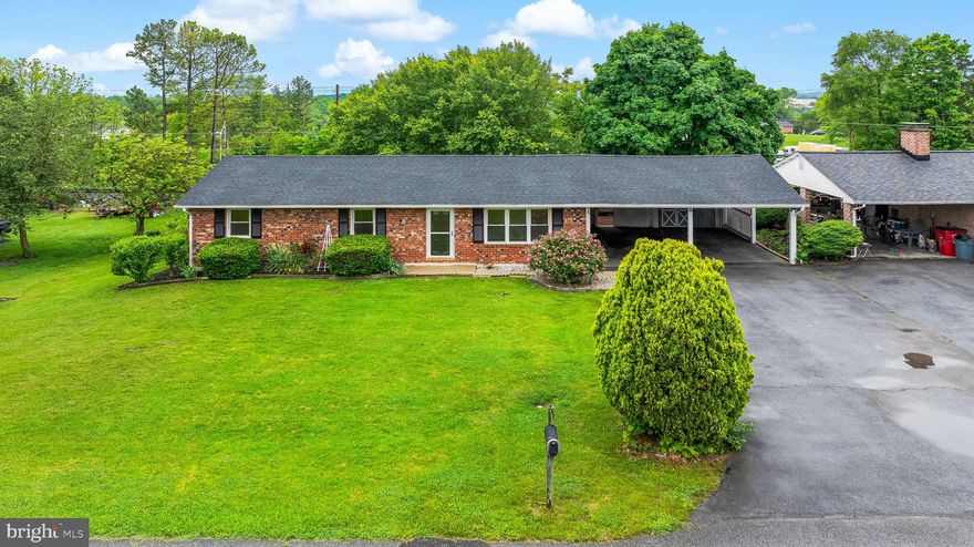 Welcome to this charming all-brick rancher offering convenient one-level living! Featuring 3 spacious bedrooms and 1.5 bathrooms, this home is ideally situated just on the outskirts of town, providing the perfect blend of tranquility and accessibility. Enjoy a host of recent upgrades including a brand new roof & gutters, stunning granite countertops, fresh paint throughout, and new carpet & LVP flooring. Entering this gorgeous rancher you'll step into the spacious living room, then make your way to the modern kitchen featuring stainless steel appliances, adjacent to the dining room. Down the hall, you'll find a convenient laundry room and 3 spacious bedrooms, one of which includes its own half bath. Outside, enjoy the expansive oversized two-car carport and ample driveway space. You'll also find two storage sheds for all your extra needs. The large deck overlooks a private backyard, ideal for entertaining or simply relaxing. Additional highlights include central air conditioning for year-round comfort. This home truly has it all and is move-in ready! Don't miss your chance to own this delightful property - the list of features goes on and on!