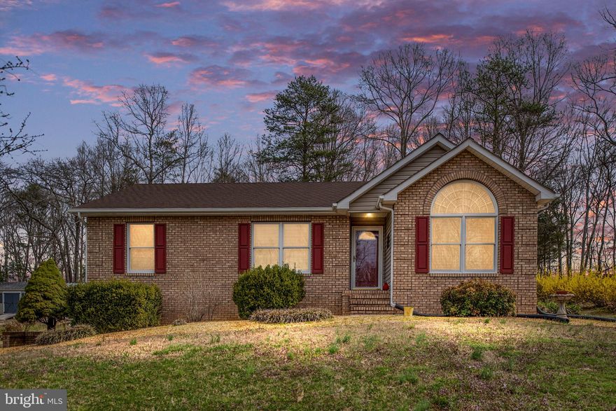 Welcome to this stunning brick ranch home situated on nearly 3 acres of beautifully landscaped and hardscaped property. With 4 bedrooms (note: the 4th bedroom is not to code), this home offers ample space for comfortable living. The property is a dream for a small business owner or someone with an array of recreational vehicles, featuring a 2-car attached garage, two large carports, a spacious metal garage/barn equipped with power and concrete floors—ideal for RV and boat storage—a separate shed, and a run-in shed. The long, fully paved driveway leads you to this private retreat, set back from the road for added seclusion.

The remodeled kitchen is a chef's delight, boasting 42-inch cabinetry, granite countertops, and ceramic tile flooring. Adjacent to the kitchen, the sunroom provides a perfect space to relax or entertain guests. Both bathrooms have been fully renovated to include glass-enclosed tile showers and upgraded vanities with granite tops. Gleaming hardwood floors flow throughout the home, adding a touch of elegance.

The basement offers a versatile 4th bedroom that can serve as a flex space or home office. This property is equipped with a whole-home generator, ensuring uninterrupted power during outages. Additionally, it is conveniently located just 1 mile from the Stafford County line, making it an ideal location for commuting to NSWC Dahlgren, Fredericksburg, Quantico, the VRE, or I-95. Don’t miss the opportunity to own this exceptional property that’s perfect for both relaxation and functionality!