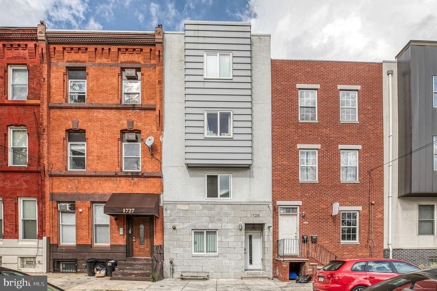 1725 W Montgomery Ave is a wonderful Triplex built in 2015. This fantastic location is walking distance to Temple University. There's nothing else like this unique property on Temple's campus. The location on Montgomery Ave is impossible to beat and the units have been fully occupied since completion.  All three units include kitchen with granite countertops, stainless steel appliances, electric stove, recessed lighting throughout, A/C, intercom system, in-unit washer and dryer, plenty of storage space and each with their own outdoor space. Unit 1 has 4 bedrooms, 2 full baths, large fenced-in backyard and all three electric water heaters located in the basement. Unit 2 features 2 bedrooms, 1 bath and a rear deck balcony. Unit 3 features 5 bedrooms, 2 baths and a huge roof deck with excellent city views. All three units are rented out; Unit 1 is $2,800 monthly, Unit 2 is $1,400 monthly and Unit 3 is $3,500 monthly. Tenants pay electric and water. Property has a great rental history; property is located in a qualified opportunity zone.