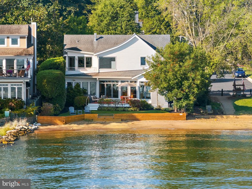 Exceptional Waterfront and Beachfront living on Horn Point in coveted Eastport. Launch your kayak or SUP after morning coffee, and watch the sailboat races from your deck, yard, and beach later that day. This elegant charmer is the Perfect place to watch the Blue Angels without leaving home! The home was completely re-built in 2009 (all that remains is the original garage floor) and has been meticulously maintained.  Upon your first steps inside, you'll be drawn to spectacular views of the Severn River as you walk through an open floor plan adorned with rich Brazilian hardwood flooring and abundant natural light. The main level offers a great room with a perfectly blended family room, dining area with a gas fireplace, a second sitting area, a gourmet kitchen and private deck. A separate hall leads you to 2 spacious bedrooms and full bath. The gourmet kitchen is a chef's dream, featuring upgraded countertops, stainless steel appliances, and a generous island perfect for entertaining. Dining and relaxing on your private deck overlooking the yard and beach is steps away from the kitchen. Privately located behind the kitchen the home gym with vaulted ceilings and water views can be converted to a home office, play area, an additional sitting room, and more.  The main level laundry room and hallway to the garage also lead you to a bonus work-room attached to the garage.  This room could easily become a creative space, painting studio, she-shed, or additional home office.   The beautiful floating staircase complements the great room and leads you to the upper level.  The primary suite is all about the view! Breathtaking Severn River and Chesapeake Bay- front views and a spa-like bathroom with a jetted tub and walk-in, steam shower. The primary suite would not be complete without a large dressing room with access to a separate home office / sitting room with water views, and private deck. The fourth bedroom with en suite is on the upper level, with a walk in closet and access to attic storage. The exterior is equally impressive, showcasing a yard and private beach on the Severn River. Relax on the balcony or deck, surrounded by lush landscaping and exterior lighting that enhances the ambiance. The property also includes an attached garage with attic storage above it and ample driveway space for convenience. A generator is included and a pier is an option for your buyer. With a prime bayside location, this home offers not just a residence but a lifestyle of luxury and tranquility. Experience the perfect blend of modern amenities and natural beauty, making every day feel like a vacation. Don't miss the opportunity to call this remarkable property your own!