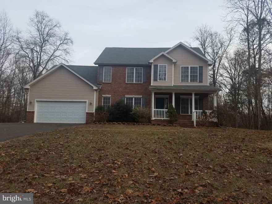 Comfortable colonial on over 6 acres, just a  short distance to town of Orange and close to Rapidan road., Master suite as well as kitchen and family room look out over mature landscaping and peaceful country setting. , paved driveway,