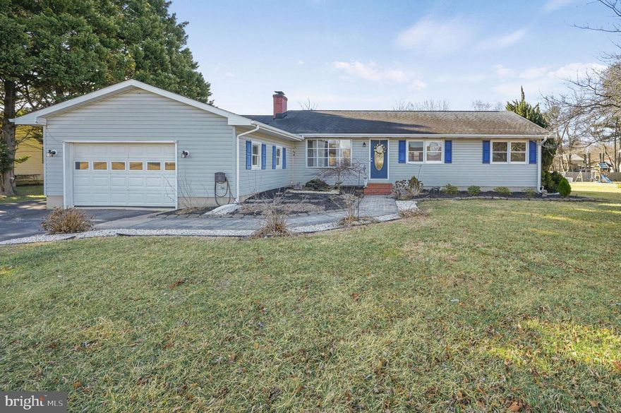 Discover this charming 3-bedroom, 2-bathroom home in the Caesar Rodney School District, offering a prime location close to shopping centers, major routes, and Dover Air Force Base—all with no HOA restrictions!
Step inside to find beautiful hardwood floors throughout the living room, complete with custom built-ins, a cozy gas fireplace, and a bright bay window that fills the space with natural light. The home features two spacious bedrooms with a shared hall bath and a large primary suite with its own private bath. The kitchen and dining area offer ample cabinet space, a built-in refrigerator, and direct access to a generous family room that leads to the backyard.Outside, you’ll find a private oasis perfect for entertaining and relaxation—including a pool with a deck, two fire pit areas, a large yard, a shed, and beautiful landscaping throughout. Enjoy outdoor living under the covered patio or take advantage of the extended driveway, ideal for parking an RV, boat, or additional vehicles. The two-car garage provides plenty of storage and direct access to the mudroom/laundry area.
The partially finished basement includes one finished room with a closet and additional flexible space ready to be transformed to fit your needs. This home also features a well and a water filtration system, and the yard is professionally treated yearly for lush, green grass. The beautifully landscaped front yard boasts a serene koi pond, adding to the home’s curb appeal.
Don’t miss the chance to make this wonderful home your own!