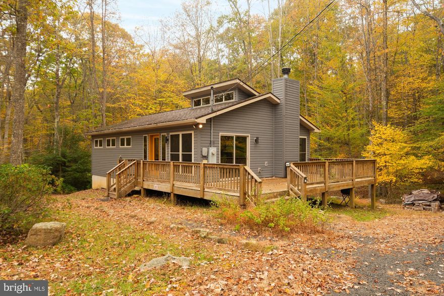 Check out this amazing opportunity to own a meticulously maintained home in the beautiful, one of a kind community of Alpine Lake Resort. This property is recently remodeled with beautiful finishings and features vaulted ceilings with an abundance of high end windows in every room letting in  idyllic natural light and a wooded state park like view.  Backed against community greenspace and sitting on a double lot this location ensures privacy throughout your ownership.  The main level has two bedrooms and one full bath, while the lower level is fully finished with an additional bedroom, full bathroom, and entertainment/living room. A natural creek with step over bridge, firepit, and deck space offers an ideal spot for peaceful evenings and days outdoors. While the natural stacked stone wood burning fireplace and natural wood finishings give you a cozy retreat in the colder months. The home comes turnkey with higher end Amish made table, Amish made walnut and Ambrosia maple bedroom sets, real leather couches and chairs and everything else to ensure you're ready to step into your new home. Alpine Lake is a gated access resort where ownership offers a multitude of benefits including: an 18 hole golf course, mini golf course, Lake access, Hiking, biking, and cross country skiing trails. A great lodge overlooking the lake with an indoor swimming pool, fitness room, game room, dining room, bar, and more! Call today before this one is gone!