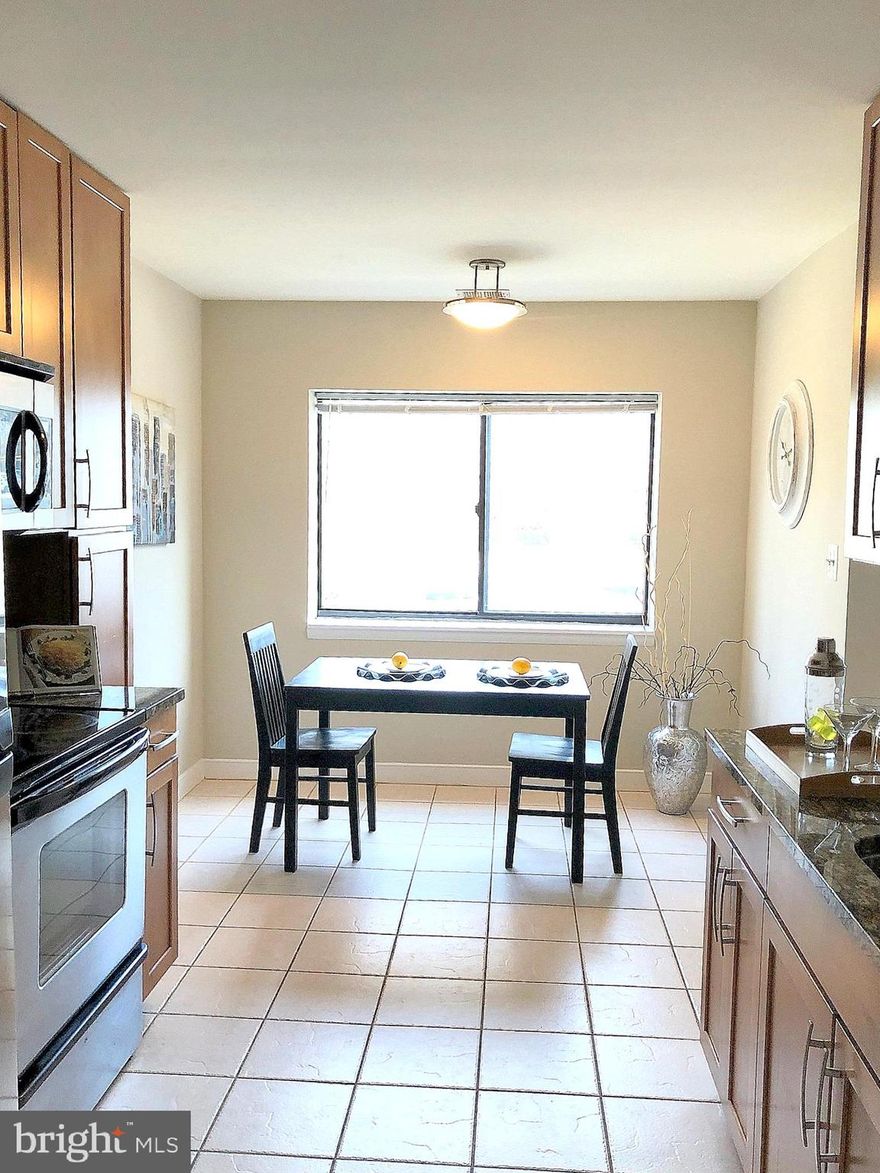 Beautiful, bright, light-filled  end unit on 2nd floor with private balcony. Lovely hardwood floors in the dining room, family and hall. Eat-in kitchen has stainless appliances, granite countertops, and ceramic tile flooring. Freshly painted and brand new plush carpeting. North Green is an intimate community surrounding a central pool with outdoor grilling and bar. Directly across from state of the art fitness facility "Pip" Moyer Recreation Center offering indoor track, rock climbing, skate park, ball fields and more. Prime location, only 5 minutes to downtown Annapolis and all of the festivities in Eastport.