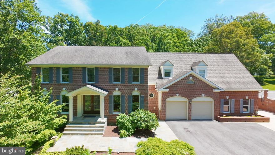 This home must be seen to be believed.  It offers a lifestyle, not just a residence.  An extraordinary property, nestled on almost 2 acres, thoughtfully designed to create an estate.  It is located in the sought-after community of Miller Heights, known for its outdoor lifestyle and miles of park trails.  The home itself offers about 5,700 square feet of thoughtfully updated space, and 4 bedrooms and 4.5 baths.  But, in addition to the house, the Property includes additional structures, to include a two-story workshop and "The Barn", with 2 garage-doored bays and an upper-level studio with its own private entrance.  The 2-car attached garage (with a wall-length workbench) and the two-story workshop and the barn studio are all heated and cooled.  Beyond even that ... hidden in a room off the patio is a potting room with its own heating/cooling system, dehumidifier and built-in shelving and sink.  These additional living spaces add about 1200 square feet of usable space, to accommodate any lifestyle.  ... A handsome slate walkway ushers you in, to a formal center hall foyer, floored in gleaming finished-on-site hardwood.  Straight back, the family room is floored is stunning slate and enjoys a two-story vaulted ceiling, as well as a wood stove with brick hearth.  French doors guide you into the Sunroom, , with breathtaking hand-scraped hardwood flooring, cathedral ceiling and 3 walls of windows overlooking the acreage.  It opens to the patio and deck (plumbed with gas line for grilling).  The Kitchen was stunningly updated in 2015  and it offers natural cherry cabinetry, quartz counters, and a tile backsplash. It is well-appointed with top of the line stainless steel appliances, to include a Wolf 6-burner gas cooktop.  Other appliances include a Miele wall oven, built-in microwave, warming drawer and dishwasher, as well as a Jenn-Air French door refrigerator.  The Kitchen is floored in Travertine.  A Breakfast Nook overlooks the patio and garden through a charming bay window.  The main level study is thoughtfully located off the living room, away from household bustle.  The mudroom/laundry accesses the garage.  It features a commercial Speed Queen washer and dryer.  A powder room completes the main level.  The Upper Level offers 4 spacious bedrooms and 3 full baths.  An enormous Owner's retreat presents a spacious bedroom, a dressing alcove with 2 closets (one walk-in) as well as a spa-inspired bath.  The bath is sheathed in Travertine and enjoys a soaking tub overlooking the treed backyard, a glass-sheathed shower with multiple showerheads, as well as a cherry vanity with dual sinks and large tower for towel storage.  It even has fixtures from the Watergate!  Two ancillary bedrooms share a buddy bath and a 4th bedroom enjoys its own bath.  The walkout lower level is expansive.  It offers a rec Room, Game Room, Full Bath with Silestone Countertop and a closet with a large safe as well as a walk-in closet.  A large storage/utility room offers plenty of space for seasonal items.  Off the lower-level patio is a potting room with a sink and its own HVAC system and dehumidifier.  Become the gardener you were meant to be!  ... Beyond the house, there is so much more!  A low-maintenance deck, large slate patio, and gardens beckon you to outdoor leisure.  A small garden shed graces the woodland garden.  A large Barn offers 2 bays with garage doors and an upper-level studio with private entrance.  The Barn has its own HVAC system and water heater. The 2-car attached garage is also heated and air-conditioned and presents a sprawling workbench and ample storage.  The adjacent two-story workshop is the ideal space for the hobbyist.  The garage and adjacent workshop share an HVAC. A tool shed sits alongside the workshop. ... This home is one of a kind.  Nestled on almost two acres, in a community threaded with trails and enveloped in parkland.  Not to be missed...  Oakton HS pyramid.