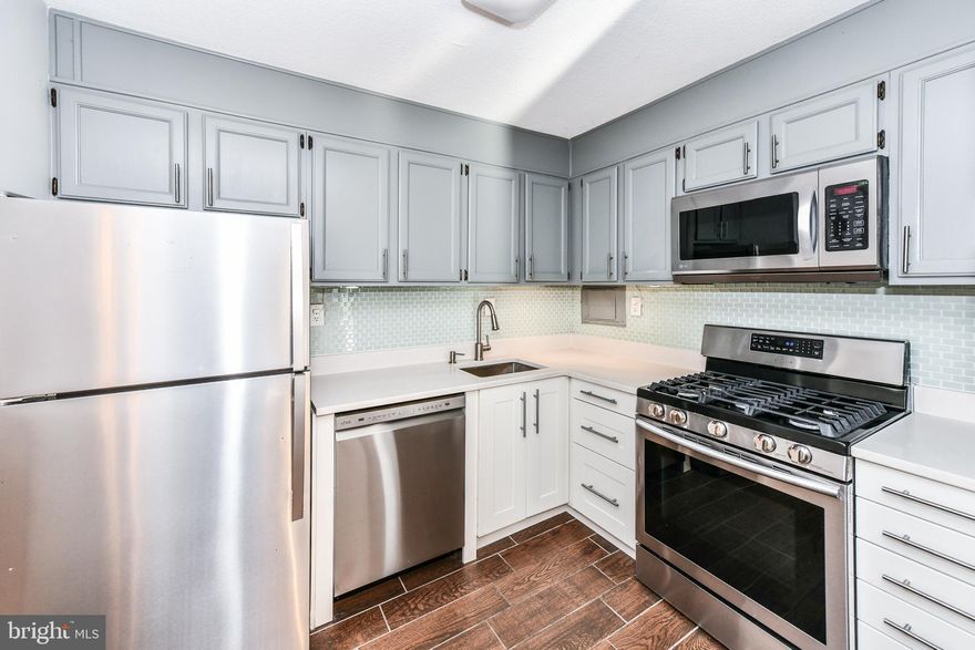 Remodeled & Gorgeous 2BR, 1BA Condo in The Carlton of Arlington*Lovely hardwood floors entire main level with neutral paint tones throughout*Kitchen with Quartz Countertops, ample cabinetry in tones of white & light grey, complementary backsplash, tiled hardwood-look floors & Stainless-steel gas Stove with Convection Oven*Spacious living room off kitchen with sliding glass doors leading to balcony*Two nicely sized bedrooms share updated full bathroom with granite vanity & tiled hardwood-look floors*Primary bedroom features walk-in closet with sliding glass doors leading to balcony*Multiple laundry rooms on each floor, with one just steps away from the unit*Building amenities include 24 hour security & concierge desk in Lobby Interior*Condo amenities include Gym, Tennis Courts, Pool, Party Room, Fitness Center Large fully equipped fitness center Tennis Courts – Two tennis courts Dog Parks – Close by dog parks Pool – Large outdoor pool Party Room Right on the bike path (four mile run trail and W&OD Trail)*Only one pet allowed, the weight of the pet is not to exceed 25 pounds. *NO CATS *