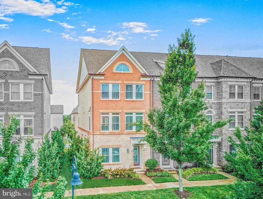 Stunning End Unit in the Coveted One Loudoun Community! Welcome to this rare and luxurious NV Cornelius Vanderbilt model situated on a premium lot in Loudoun County’s premier lifestyle destination. One Loudoun. This home blends upscale living with unbeatable convenience. Step inside to discover rich hardwood and designer tile flooring, an open-concept layout, and abundant natural light throughout. The Chef’s Kitchen is a true showstopper, featuring high-end GE stainless steel appliances, granite countertops, a spacious breakfast bar, and upgraded cabinetry—ideal for both everyday living and entertaining. Upstairs, the expansive Owner’s Suite offers a serene retreat with dual walk-in closets, a tray ceiling, and a spa-inspired bath with elegant finishes. Additional standout features include a private deck, generous storage room, upper-level laundry, custom wood blinds, and a two-car garage. Living in One Loudoun means you’re just steps away from trendy restaurants, shops, Alamo Drafthouse Cinema, Trader Joe’s, weekly farmer’s markets, and seasonal events. The community also offers resort-style amenities such as a clubhouse, pool, fitness center, tennis courts, and miles of trails. Don’t miss your chance to own this exceptional home in one of Northern Virginia’s most vibrant and sought-after communities!