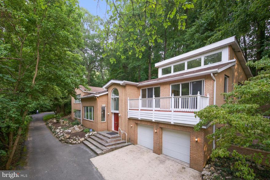 This is the one you’ve been waiting for! Rare opportunity to own almost an acre in Bannockburn, one of the most highly coveted neighborhoods in Bethesda. Tucked away on a lush, wooded lot in a private cul de sac, this hidden gem offers over 5,900 square feet of living space that’s an entertainer’s dream! Boasting tons of natural light, soaring ceilings, and beautiful, mature landscaping, you don’t want to miss the chance to make this contemporary beauty yours.

Upon entry, you’ll love the grand two-story foyer and open-concept space on the main floor. Enjoy the dining room, huge family room with the first of three fireplaces, spacious kitchen, home office with French doors, all offering beautiful green views of the surrounding area. Access to the two-car garage, a full bathroom, and a convenient laundry room complete the main floor.

Upstairs, you’ll find an incredible great room with cathedral ceilings, a fireplace, built-ins with wet bar, and a stunning balcony as well as access to the extensive hardscape backyard, perfect for indoor-outdoor living and entertaining. A full bathroom provides the utmost convenience for guests. Continue to the main living wing, featuring four large bedrooms, all with en-suite bathrooms and ample closet space. The primary suite boasts a large walk-in closet and fireplace, as well as a bonus room with tons of natural light - perfect for a sitting room or home office!

Location, Location, Location!  Enjoy the peace and privacy while also being conveniently located in the award-winning Whitman school district, near downtown Bethesda, 1-495, the D.C. border, Chain Bridge, and so much more! This home offers the perfect opportunity for its new owners to update and make it their own!