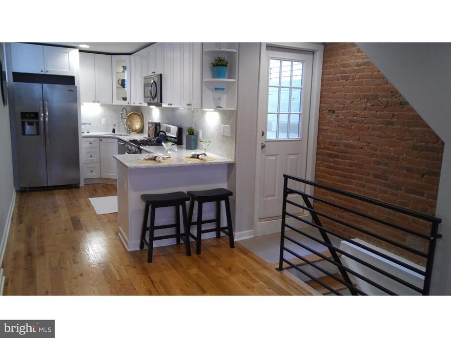 Like new in Philly's hottest neighborhood. Gorgeous 3 story, 3 bedroom, 2 bath Home in the heart of Fishtown. First floor features open floor plan with exposed brick, hardwood floors, large dinner area, and gourmet kitchen. Kitchen has beautiful white cabinets, marble counter tops, marble back splash, stainless steel appliances and tons of natural light. Off the kitchen is the large rear yard with custom fencing and built in seating area. Plenty of space for grill and patio table for summer entertaining. Finished basement with high cielings and lots more space. Second floor features 2 bedroom and 1 Full bath with great closest space. Laundry/storage room with front loader washer/dryer. Same hardwood floors. 3rd floors has 2 sky light windows for tons of natural light. Master suite with huge bath. Master bath has stand up glass shower, double vanity and tons of tiles. Tax abatement has be filed. In the middle of everything Fishtown has to offer.