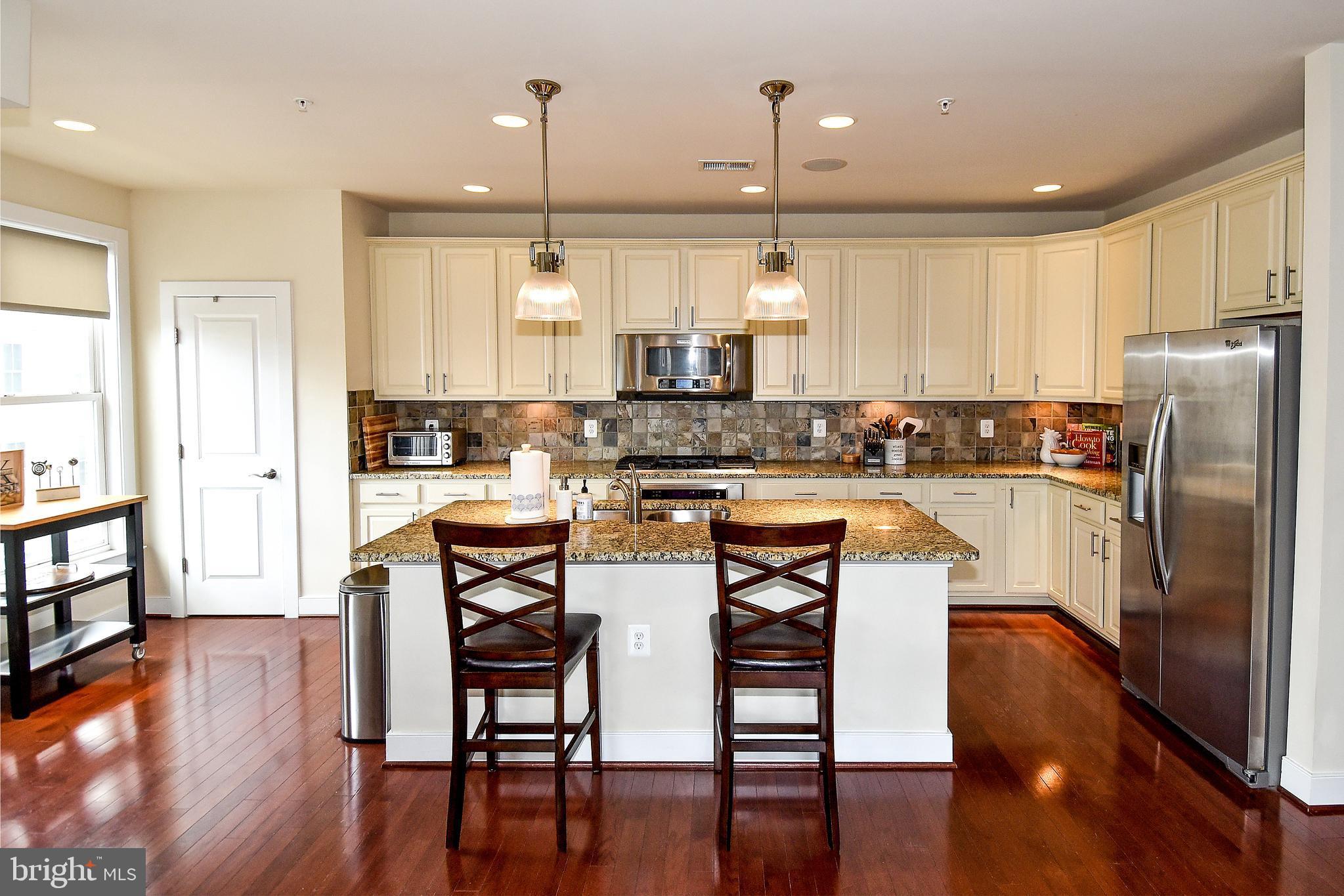 Welcome home to this beautifully appointed townhouse in convenient Potomac Yard. This community is the happening place to be. Potomac Yard continues to grow and flourish, there is so much to do in the neighborhood! Situated between National Landing, Del Ray and Old Town North there is plenty to do in your spare time. That is if you want to leave the house... Sunny and bright, this end unit lives like a detached home with elegant finishes, gleaming hardwood floors, granite countertops, oversized windows, a cozy balcony, custom blinds, and BOSE surround sound speakers. Enjoy cooking and entertaining in the gourmet kitchen or lounging in the spacious living room, the cozy family room, or the huge primary bedroom suite. The rooms are spacious and inviting, with great views to be enjoyed from the plentiful windows. A glimpse of the Washington Monument can be enjoyed from the living room, and the air traffic over the Potomac in the distance is an entertaining diversion. If you work from home, you will find this to be the perfect nest. If you commute, this house is situated with easy access in every direction by metro, bike path, bus, parkway, side streets or highways. This is one you won't want to miss! * Photos from previous listing *Amazon Echo on premises