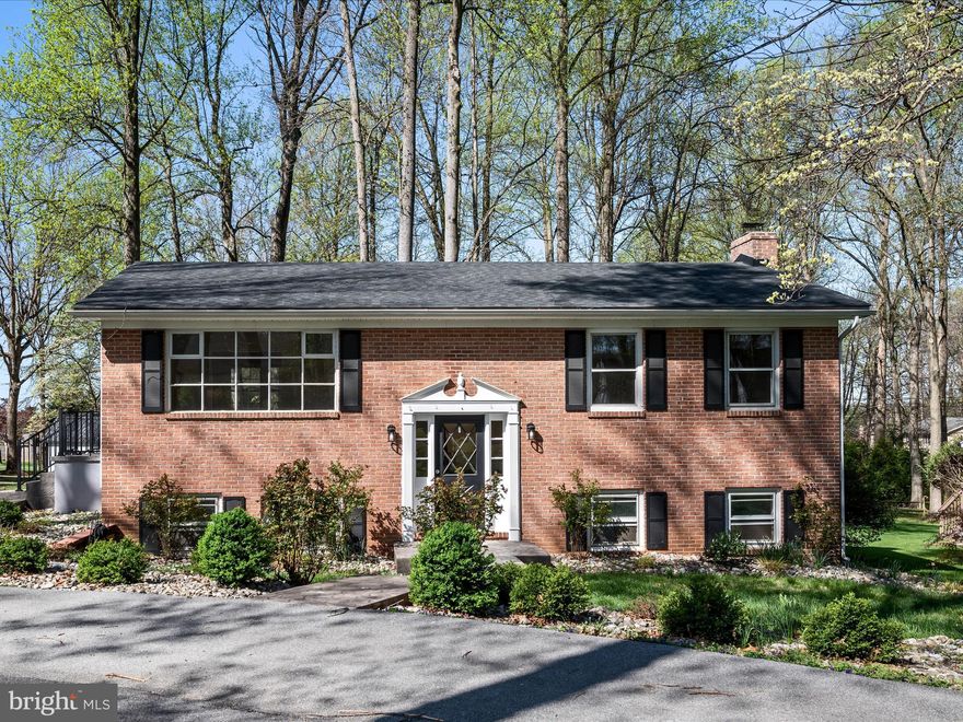 Stately home in the established Tuscawilla Hills community - close to golfing, playgrounds, and more! Nestled on a half-acre corner cul-de-sac lot, this home welcomes you with a circular drive, stamped concrete walkways, and mature landscaping that enhances its curb appeal. This 2-level residence features a primary suite with large walk-in closet and ensuite bath on the same floor as the kitchen, dining, and living room spaces - all featuring newer LVP flooring. The updated kitchen has charming accents, newer appliances, and a built-in pantry. Another full bath on this floor adds convenience and comfort for guests. There's more to appreciate on the lower level, which features a large rec room with wood stove and built-in bar area that opens to the back patio, plus 2 more bedrooms, another full bath, and laundry facilities. All of the carpeting was just replaced as well. In the backyard, there's a large shed and an ideal place to erect an above ground pool to enjoy the upcoming summer months. With easy access to Rt. 51, downtown Charles Town, commuter routes, and other local amenities, this versatile home affords the proximity and features you'll love. Make this move-in ready space your own!