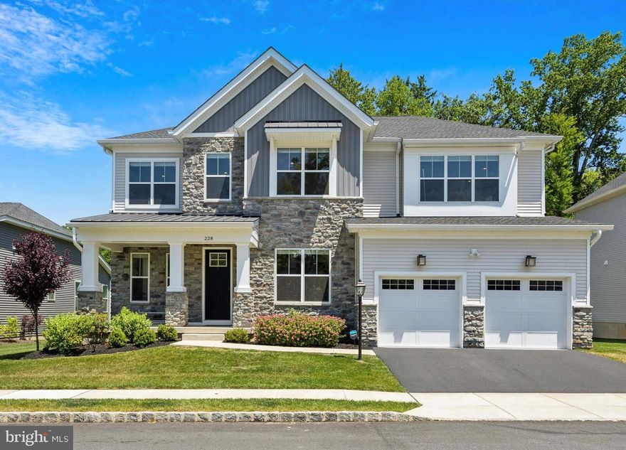 Welcome to 228 Lily Lane, a stunning 5-bedroom, 5.5-bath single-family home located in the top-ranking Unionville-Chadds Ford School District. This immaculate home was built just 3 years ago on a premium cul-de-sac lot in the prestigious Unionville Walk community and boasts countless upgrades and post-construction additions including an integrated outdoor living space, a main level guest suite, and a finished walk out basement. Step onto an inviting covered front porch and enter a home flooded with natural light, highlighting the luxury vinyl flooring that flows throughout. Custom Hunter Douglas Soft Shades add a touch of sophistication to every room. The airy foyer provides access to a large coat closet, a modern powder room, and a dining room adorned with contemporary pendant lighting. The open floor plan flows to the show stopping living room with its high ceilings and floor-to-ceiling ‘California style’ sliding glass wall that seamlessly blends indoor and outdoor living with the covered patio. Serene, tree-lined views provide the perfect backdrop for relaxation and entertaining. The living room also features a sleek gas fireplace, access to the sun-kissed study from 2 entry points, and flows flawlessly into your spacious, fully-equipped kitchen.The modern kitchen is a chef's dream, featuring a massive waterfall edge concrete counter with seating, storage and a beverage fridge, upgraded stainless steel appliances, subway tile backsplash, a 6-burner gas stove, two ovens, and a bright breakfast nook with additional access to the covered back porch. Tucked behind the kitchen is your private guest suite with a walk-in closet and full bath ensuite, ideal for visitors. Rounding out the main level is your spacious pantry, with access to more closet storage and your 2-car garage with an electric vehicle charger.Head to the second level where you will find a cozy loft area that leads to two generously-sized bedrooms with a jack-and-jill full bath ensuite, equipped with a double sink vanity and a private washroom. Make your way down the hall where you will find another sizable bedroom with a walk-in closet and full bath, your laundry room with utility sink, and the opulent primary bedroom. The primary bedroom offers a luxurious en-suite with 2 separate modern vanities with sleek, black hardware, an oversized glass stall shower with a dual wall mount and rainfall shower head, a private water room, and an enormous, custom-built walk-in closet. Make your way to the recently finished lower level where you will find the massive multi-purpose living area that gives access to a bright bonus room or bedroom with private entry, full bath, and multiple storage areas. Conveniently located in Kennett Square with easy access to restaurants, shopping, the award-winning Unionville High School and easy commutes to both Wilmington and Philadelphia, homes like this don’t last long, so schedule your showing today.