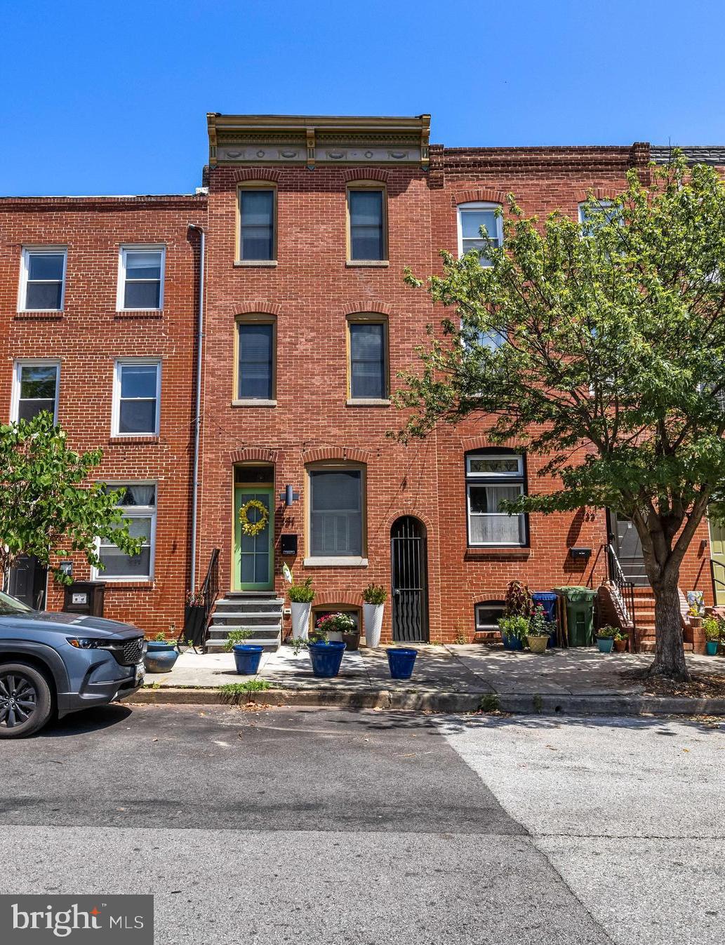 Discover the perfect blend of contemporary design and comfortable living in this renovated three-bedroom, three-and-a-half-bath townhouse located in the desirable Fells Point Historic neighborhood. From the moment you enter, you’ll appreciate the thoughtfully designed layout, modern finishes, and abundant natural light. Gleaming hardwood floors run throughout all three levels , complementing the clean lines and open flow of the home. The Living and Dining areas connect seamlessly to the sleek Kitchen with exposed brick walls, handsome cabinetry, newer stainless appliances(2024) and granite countertops—perfect for everyday living. Upstairs on the 2nd level you'll find 2 generous bedrooms & 2 baths plus an office area. The Primary on the 3rd level includes plenty of closet space, spacious bath and access to the oversized & newly install roof deck with skyline views. The outdoor courtyard is perfect for entertaining or relaxing plus the versatile shed offers extra storage or could easily be transformed into a cozy she shed or creative studio. Plus the only house on the block with their own Sally Port. Prime location and walking distanced to Patterson Park . Nothing to do but move in and enjoy!