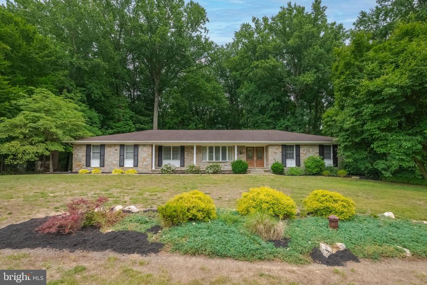 **OFFER DEADLINE SUNDAY, JUNE 25 at 5 PM** If space is what you need this home is for you! 4 full bedrooms on the main level and a ton of space in the lower level to add more.  3 full bathrooms and 1 half bathroom/laundry room on main level.  Updated kitchen with bright white cabinets and stainless steel appliances. Kitchen opens to recreation room with real wood floors, a wood burning fireplace and french doors to your maintenance free deck. Private serene backyard with 1.47 acres to enjoy. Back inside there is a combination living room/dining room with large bay window for light. The master bedroom has laminate floors, walk in closet with pocket door, a gorgeous view of your backyard through a bay window, and private master bathroom with dual sink vanity.  Both the 2nd and 3rd bedrooms are large and neutral. The hallway full bathroom has been updated as well and skylight provides natural light. On the other side of the kitchen there is a 4th bedroom with tons of space, a bay window and a built in desk that could also be used as a home office. Outside of that is a half bathroom with a laundry room.  Downstairs is a massive game room, large den with walk out doors, 3 huge unfinished spaces and another full bathroom. UPDATES INCLUDE: hot water heater 2021, heat pump and oil furnace as back up both 4 years old, new seamless gutters with gutter guards, added insulation to attic, newer architectural shingle roof and  undergournd electric  fence.