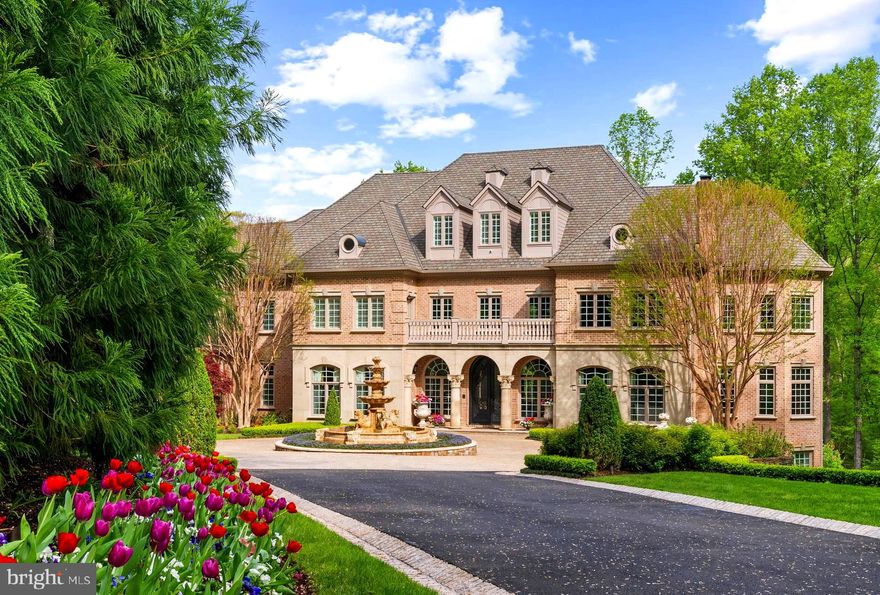 THE ESTATE AT MINE RUN:
Nestled in  the blissful hills surrounding Great Falls Park is a masterpiece of old-world craftsmanship and modern appointments. Encompassing approximately 5.44 acres of secured land; this estate affords a unique combination of privacy and accessibility.  Passing through the stately front gates is a breathtaking tree canopied sweeping driveway which culminates at the main residence with its commanding motor court and majestic fountain. The spectacular grounds feature lush specimen plantings, stunning hardscape, antique sculptures, Haddonstone garden gazebo, fountains and so much more!  The handsome facade showcases lovely arches and ornate precast columns. Step into the breathtaking foyer, where your greeted by stunning Swarovski crystal chandeliers in every room, with gleaming marble floors and soaring ceilings setting a tone of timeless grandeur. Stunning plaster moldings with gold appointments and bespoke millwork flow from the foyer seamlessly into the living, dining and great room creating an elegant continuity throughout.  The formal living room-bathed in natural light from Palladian windows overlooking the lush grounds exudes warmth and sophistication.  French doors open to the music room and conservatory/sunroom, ensuring effortless flow for both grand entertaining and intimate gatherings. The library features lovely hardwood floors with inlay  cherry borders, custom built-in cabinetry and custom shutters.  A spectacular gourmet kitchen- well appointed with crystal chandeliers, Viking range, Sub Zero and extra large kitchen islands with intricate millwork, custom cabinets and countertops,  wine/beverage refrigerators, specialty tile backsplash, generous breakfast room with fireplace and floor to ceiling windows and french doors opening to the terrace.  Primary Suite - is a sanctuary of refinement featuring 23 carat  gold leaf ceilings, angled hardwood floors, tray ceilings and a sitting room warmed by a glass-enclosed fireplace all overlooking the stunning grounds. Crystal sconces and detailed plaster moldings accentuate soaring ceilings, blending grandeur with intimacy. 
Primary Bath- spa-inspired retreat with 20 “  marble floors, marble vanities adorned with Mother-of-Pearl inlays and  intricate gold inlay  and imported Italian tile with custom solid brass fixtures. Indulge in a spa shower with body sprays or unwind in the tub - an indulgent oasis of relaxation
The walk-out lower level crafted for unforgettable gatherings features a billiards area with custom sconces and recessed lighting, a top of the line golf simulator, fireplace and a state-of-the-art theater with paneled walls and a home gym/work out room.   A full kitchen with granite counters and large breakfast bar ensures seamless hosting. A spacious recreation room with expansive windows and a playroom/bedroom with a full bath offer versatility.  Large floor to ceiling  custom doors walkout to covered terraces which are all framed by scenic views.  Tucked discreetly on the estate’s grounds is a fully appointed guest cottage offering a private retreat for guests, staff or security detail. Featuring 2 BRs, 2 BAs, hardwood floors, 2 cozy fireplaces, a full kitchen, covered screened porch and an extensive climate controlled wine cellar;  providing independent comfort and privacy. Fully fenced compound, Luscious gardens, terraces, deck, fountains. granite block paver motor court, generators for both homes, state-of-the-art security, irrigation system  complete this amazing offering.  Equestrian in the family? Many facilities in the area! (See map in documents) All within 25 minutes of Dulles & Reagan National airports - Langley High School pyramid-Registration form needs to be provided with showing request.  Thank you! Must watch video-
https://youtu.be/ulEHmGRrcbA?si=yraOjq8WQBUVlzi7