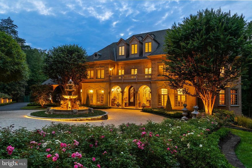 THE ESTATE AT MINE RUN:
Nestled in  the blissful hills surrounding Great Falls Park is a masterpiece of old-world craftsmanship and modern appointments. Encompassing approximately 5.44 acres of secured land; this estate affords a unique combination of privacy and accessibility.  Passing through the stately front gates is a breathtaking tree canopied sweeping driveway which culminates at the main residence with its commanding motor court and majestic fountain. The spectacular grounds feature lush specimen plantings, stunning hardscape, antique sculptures, Haddonstone garden gazebo, fountains and so much more!  The handsome facade showcases lovely arches and ornate precast columns. Step into the breathtaking foyer, where your greeted by stunning Swarovski crystal chandeliers in every room, with gleaming marble floors and soaring ceilings setting a tone of timeless grandeur. Stunning plaster moldings with gold appointments and bespoke millwork flow from the foyer seamlessly into the living, dining and great room creating an elegant continuity throughout.  The formal living room-bathed in natural light from Palladian windows overlooking the lush grounds exudes warmth and sophistication.  French doors open to the music room and conservatory/sunroom, ensuring effortless flow for both grand entertaining and intimate gatherings. The library features lovely hardwood floors with inlay  cherry borders, custom built-in cabinetry and custom shutters.  A spectacular gourmet kitchen- well appointed with crystal chandeliers, Viking range, Sub Zero and extra large kitchen islands with intricate millwork, custom cabinets and countertops,  wine/beverage refrigerators, specialty tile backsplash, generous breakfast room with fireplace and floor to ceiling windows and french doors opening to the terrace.  Primary Suite - is a sanctuary of refinement featuring 23 carat  gold leaf ceilings, angled hardwood floors, tray ceilings and a sitting room warmed by a glass-enclosed fireplace all overlooking the stunning grounds. Crystal sconces and detailed plaster moldings accentuate soaring ceilings, blending grandeur with intimacy. 
Primary Bath- spa-inspired retreat with 20 “  marble floors, marble vanities adorned with Mother-of-Pearl inlays and  intricate gold inlay  and imported Italian tile with custom solid brass fixtures. Indulge in a spa shower with body sprays or unwind in the tub - an indulgent oasis of relaxation
The walk-out lower level crafted for unforgettable gatherings features a billiards area with custom sconces and recessed lighting, a top of the line golf simulator, fireplace and a state-of-the-art theater with paneled walls and a home gym/work out room.   A full kitchen with granite counters and large breakfast bar ensures seamless hosting. A spacious recreation room with expansive windows and a playroom/bedroom with a full bath offer versatility.  Large floor to ceiling  custom doors walkout to covered terraces which are all framed by scenic views.  Tucked discreetly on the estate’s grounds is a fully appointed guest cottage offering a private retreat for guests, staff or security detail. Featuring 2 BRs, 2 BAs, hardwood floors, 2 cozy fireplaces, a full kitchen, covered screened porch and an extensive climate controlled wine cellar;  providing independent comfort and privacy. Fully fenced compound, Luscious gardens, terraces, deck, fountains. granite block paver motor court, generators for both homes, state-of-the-art security, irrigation system  complete this amazing offering.  Equestrian in the family? Many facilities in the area! (See map in documents) All within 25 minutes of Dulles & Reagan National airports - Langley High School pyramid-Registration form needs to be provided with showing request.  Thank you! Must watch video-
https://youtu.be/ulEHmGRrcbA?si=yraOjq8WQBUVlzi7