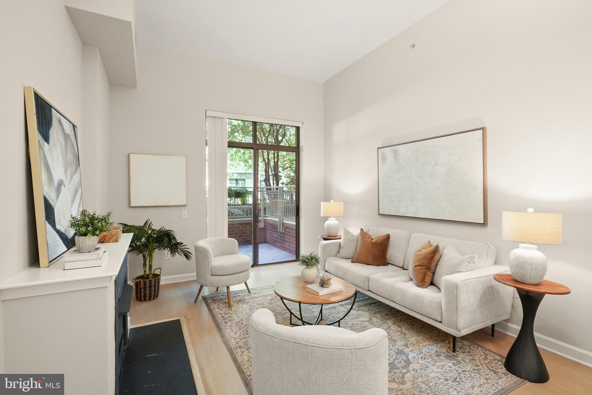 *Just Listed & Open Sunday 8/17 from 2-4pm* The best of Ballston living! An updated 1-bed, 1-bath condo offering 663 square feet in one of the orange line's premier luxury buildings—The Berkeley. Built in 2004, the home features approximately 13-foot high ceilings, a gas fireplace, and a flagstone patio tucked along the building's courtyard and private walking path.
Recent upgrades include renovated kitchen cabinetry, a modernized bathroom with a marble feature wall, custom closet organizers, new matching flooring, and freshly painted throughout, enhancing both function and aesthetic. An open floor plan offers that desired living/dining combination: gather on the patio, around the fireplace or take a seat at the breakfast bar. Ground-floor access adds ease and accessibility, while one assigned garage parking space and a separate storage unit provide valuable added convenience.
Residents of The Berkeley enjoy access to a well-appointed exercise room, concierge services, on-site professional property management, and a pet-friendly environment.
Located in the heart of Ballston, the property is directly across from Ballston Metro Station and just steps to Ballston Quarter, Quincy Park, and an array of dining, retail, and fitness options. This is an great opportunity to own a well-maintained condo in one of North Arlington's most vibrant communities.